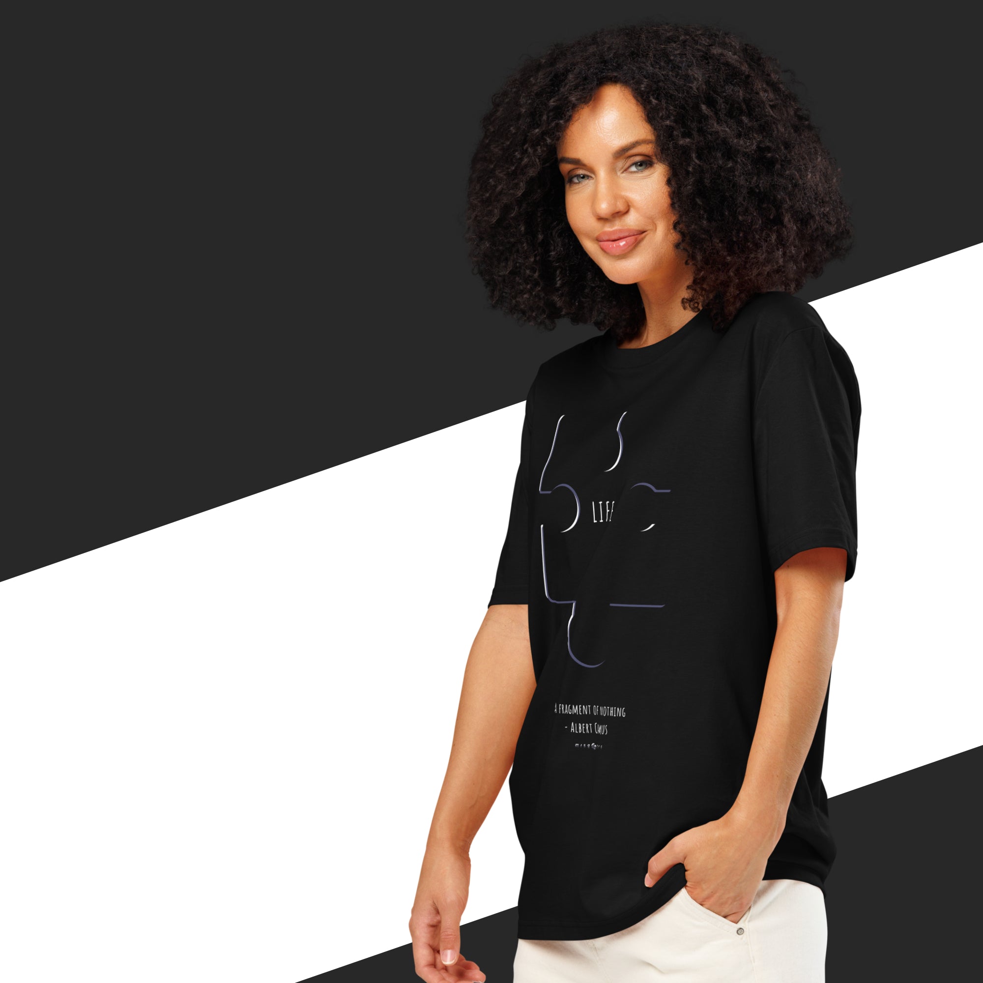 Woman wearing a black t-shirt with white text and graphics on a black and white background