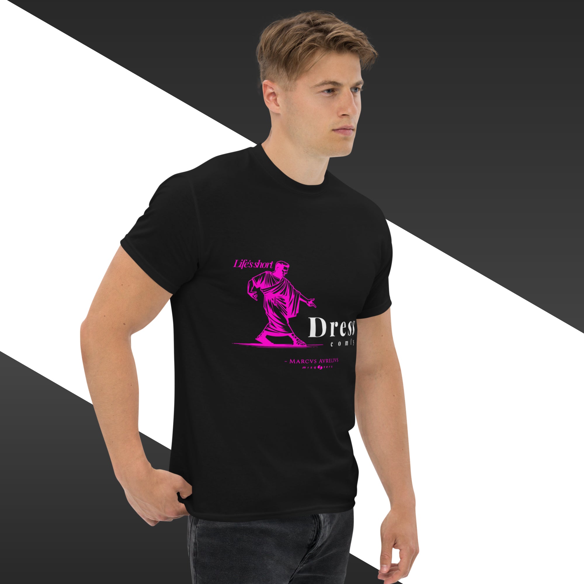 Man wearing a black t-shirt with a pink graphic design on a white and gray background