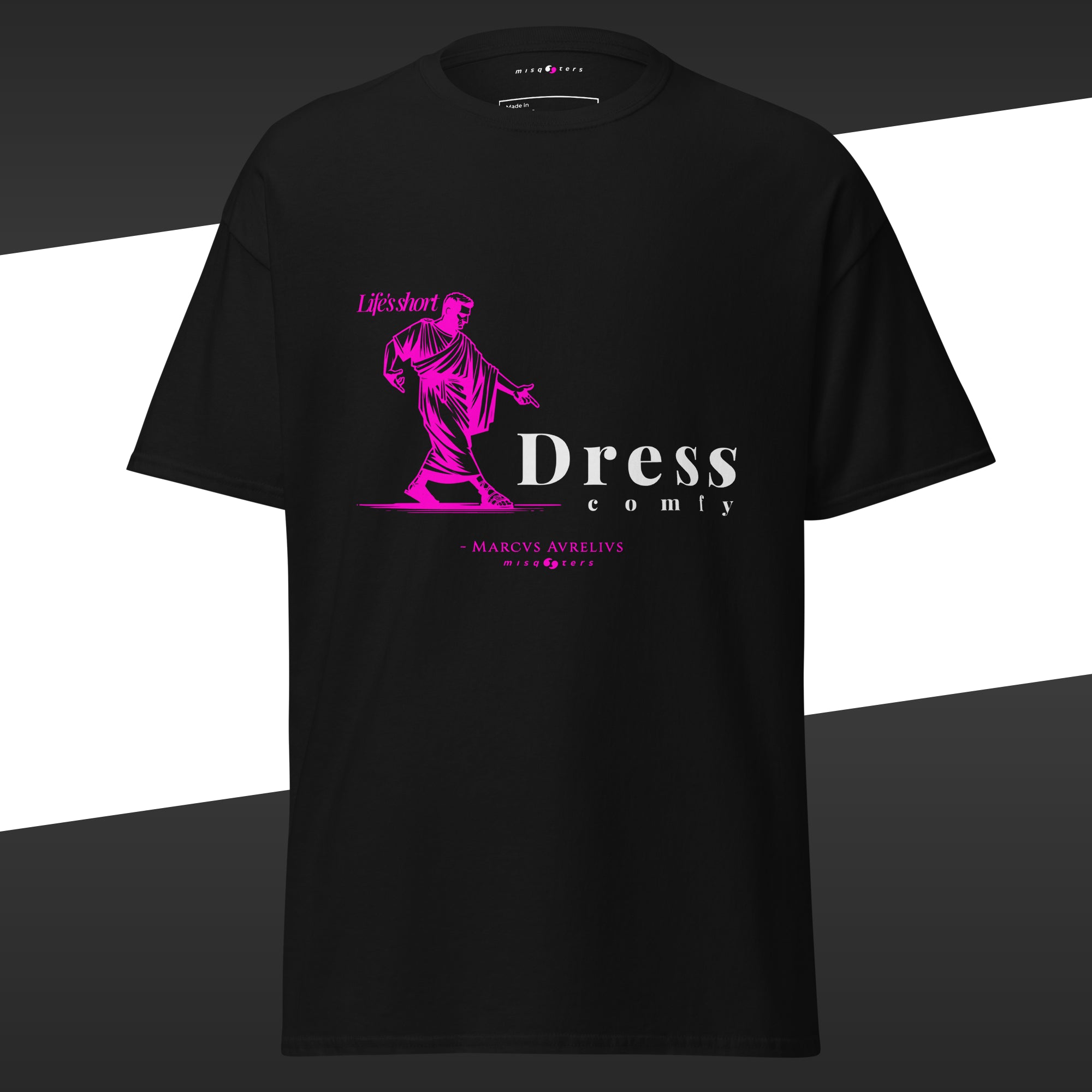 Black t-shirt with pink and white graphic design off Marcus Aurelius featuring the fake quote "dress comfy"