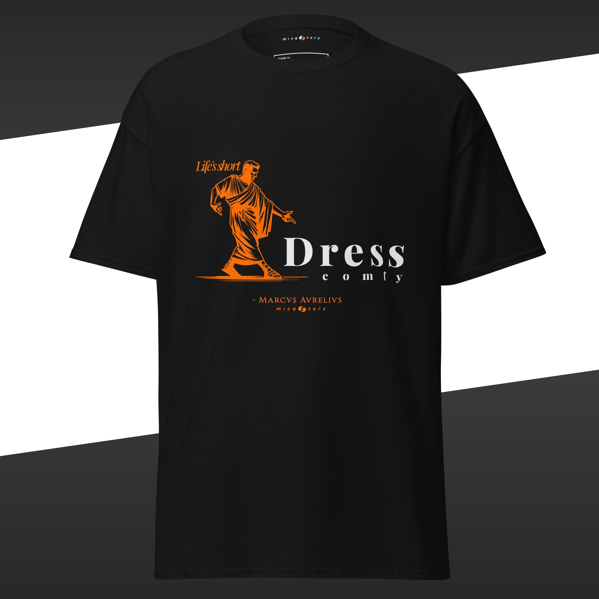 Black t-shirt with orange and white graphic design off Marcus Aurelius featuring the fake quote "dress comfy"