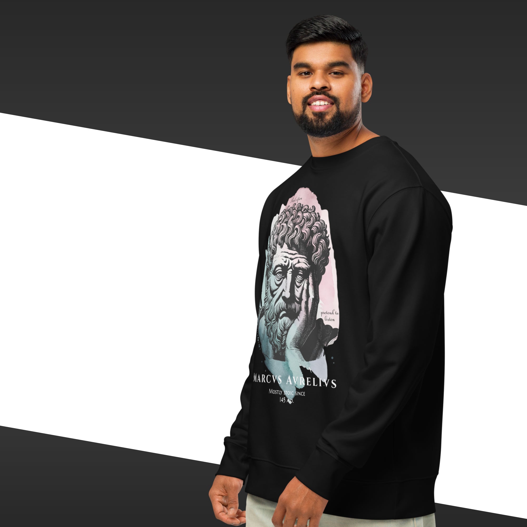 Man wearing a black long-sleeve shirt with a graphic design on a black and white background