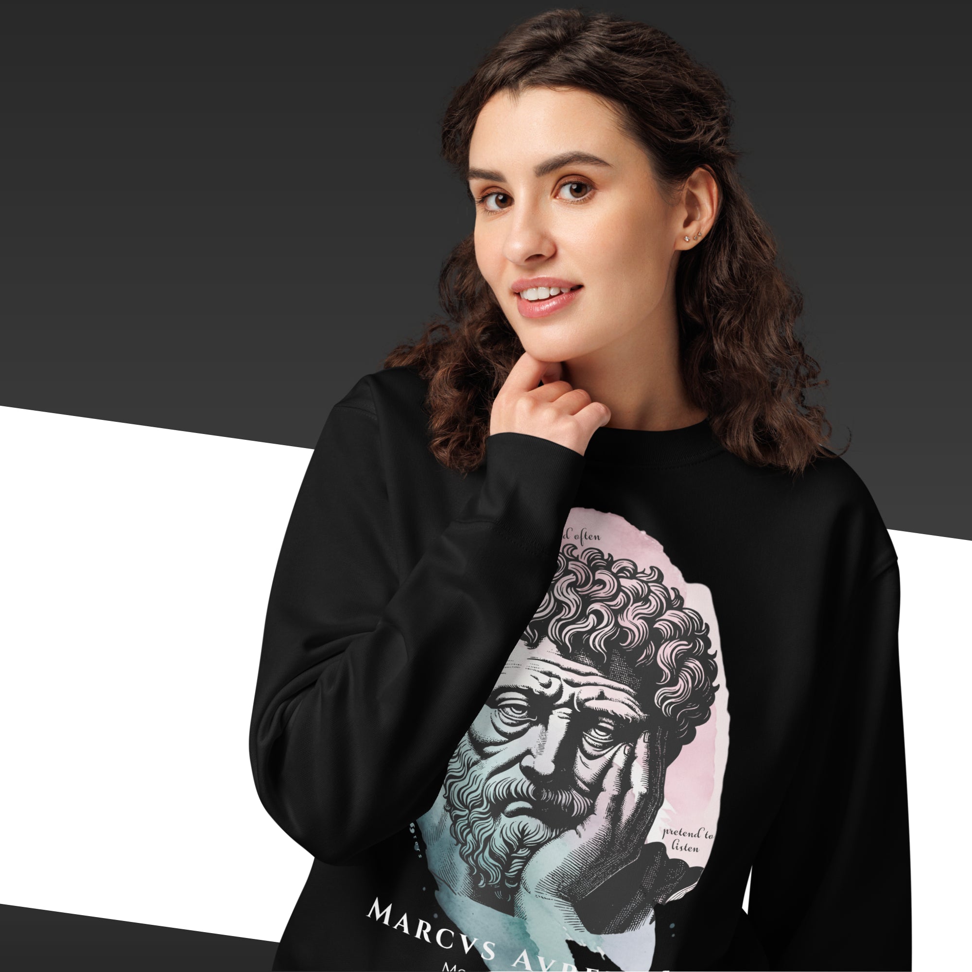 Person wearing a black hoodie with a graphic design of a classical portrait and text.
