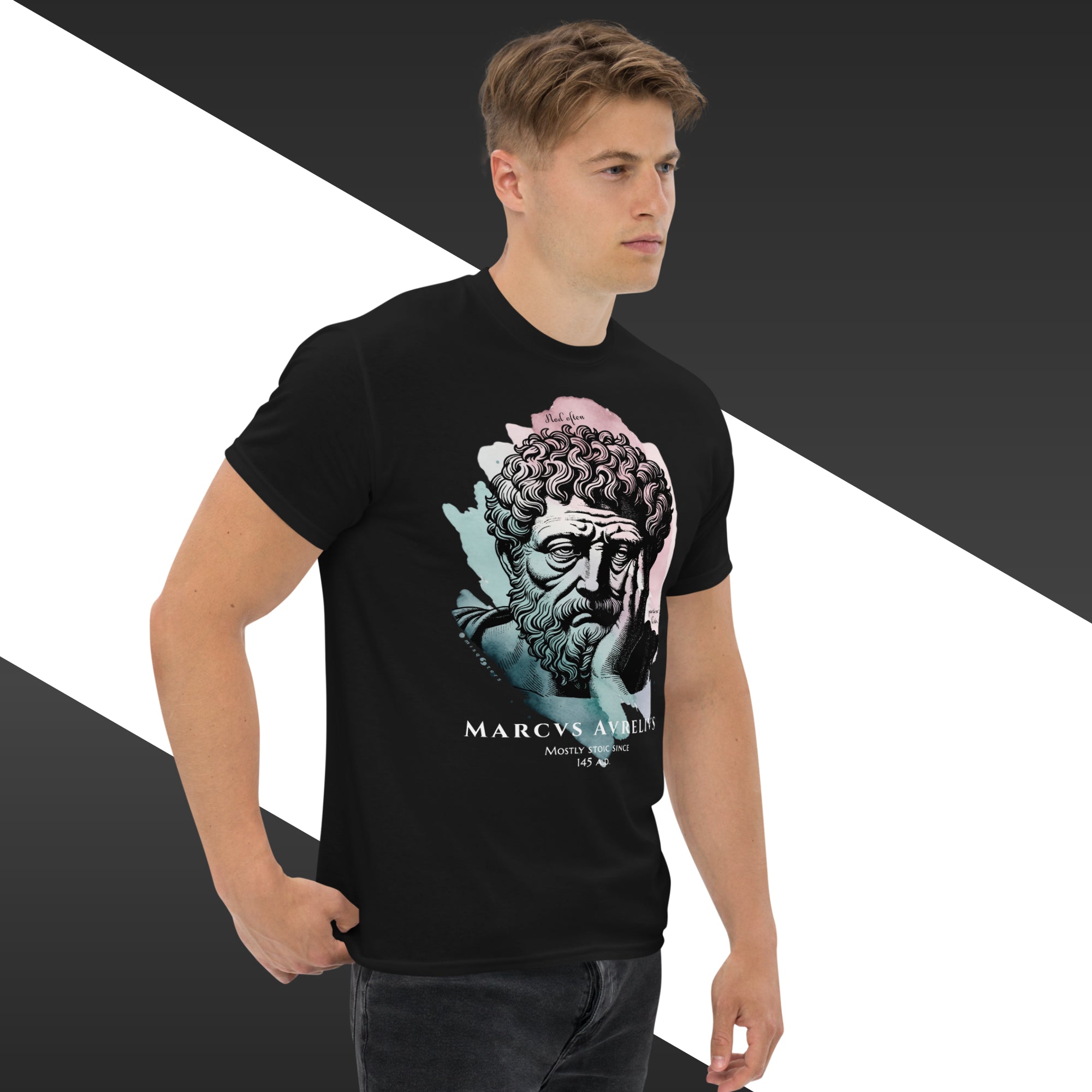 Man wearing a black t-shirt with a graphic design on a geometric background