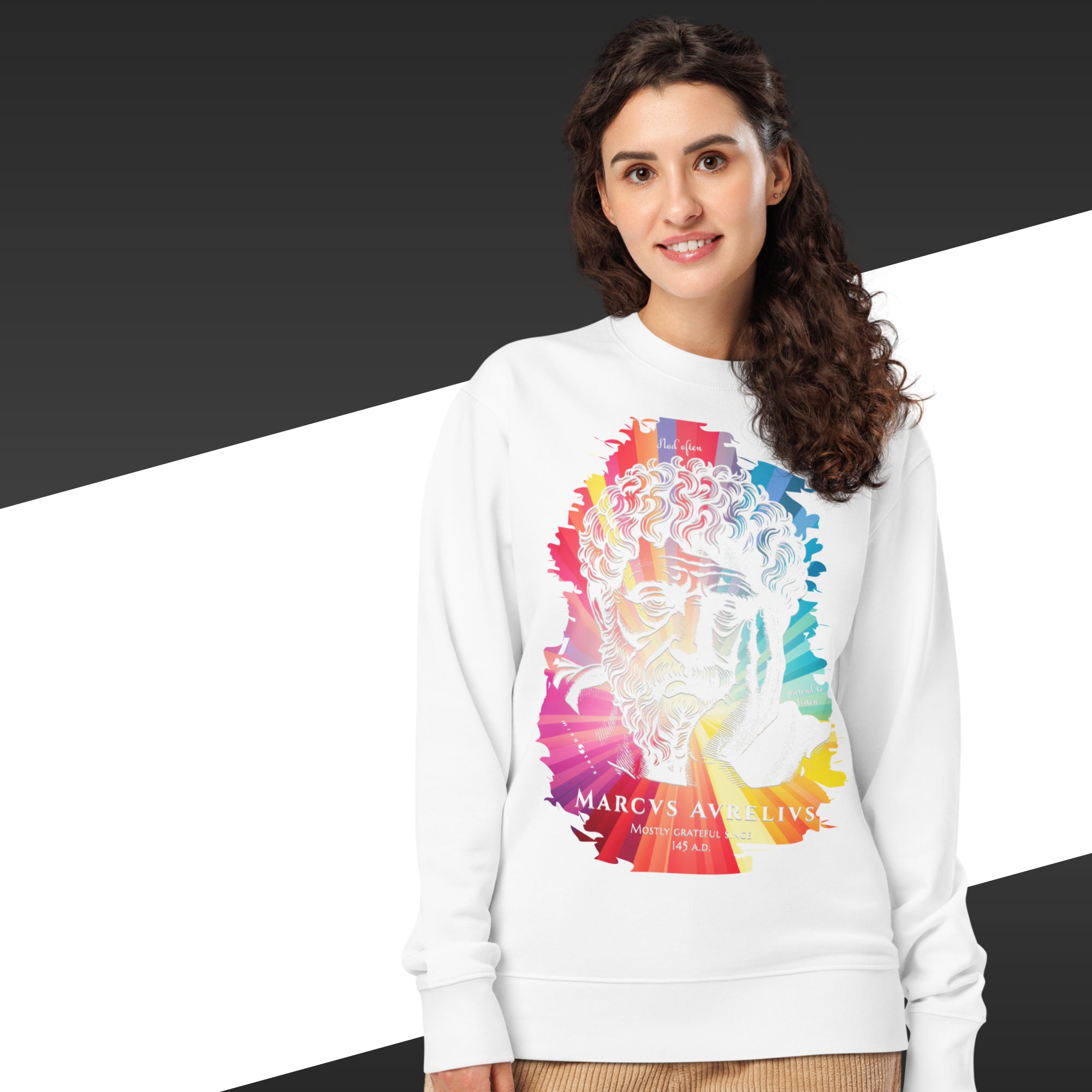 Woman wearing a white sweatshirt with a colorful graphic design and text on a black and white background
