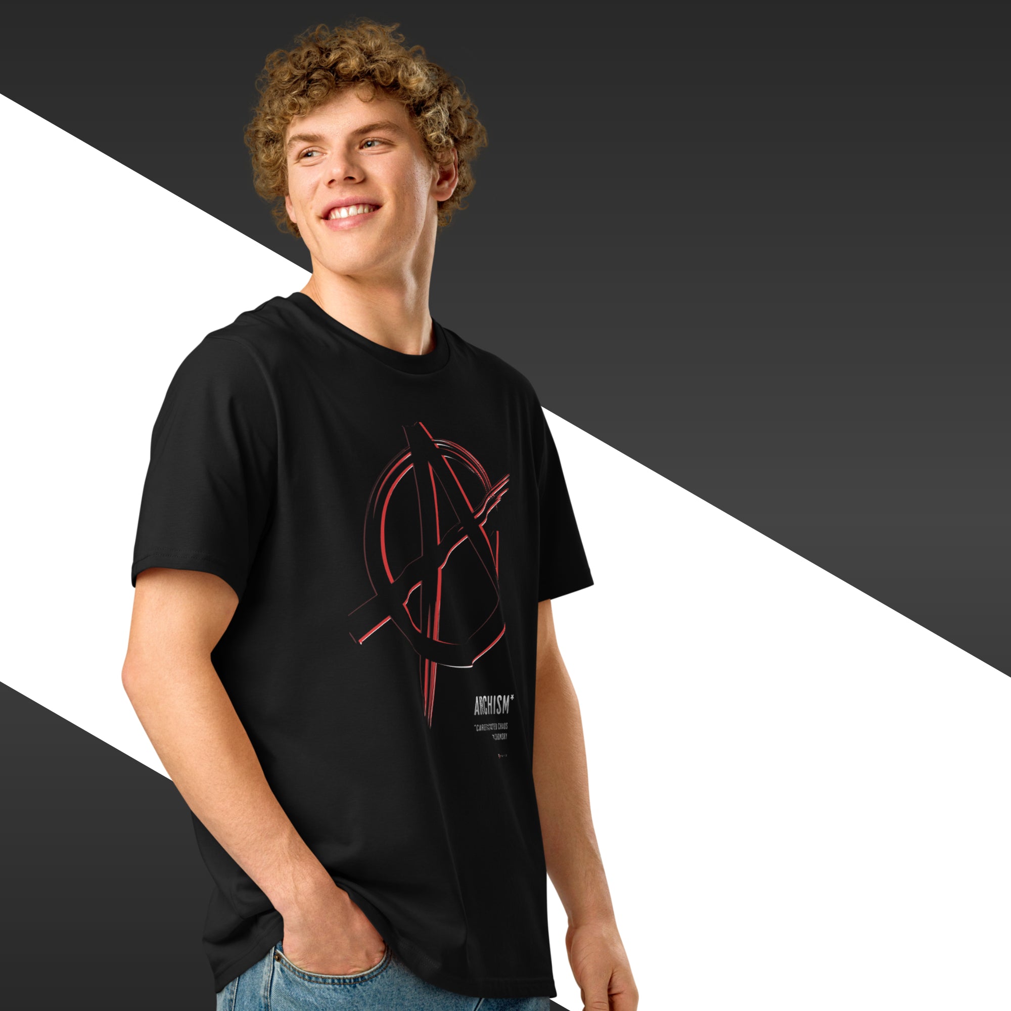 Man wearing a black t-shirt with a red graphic design on a two-tone background