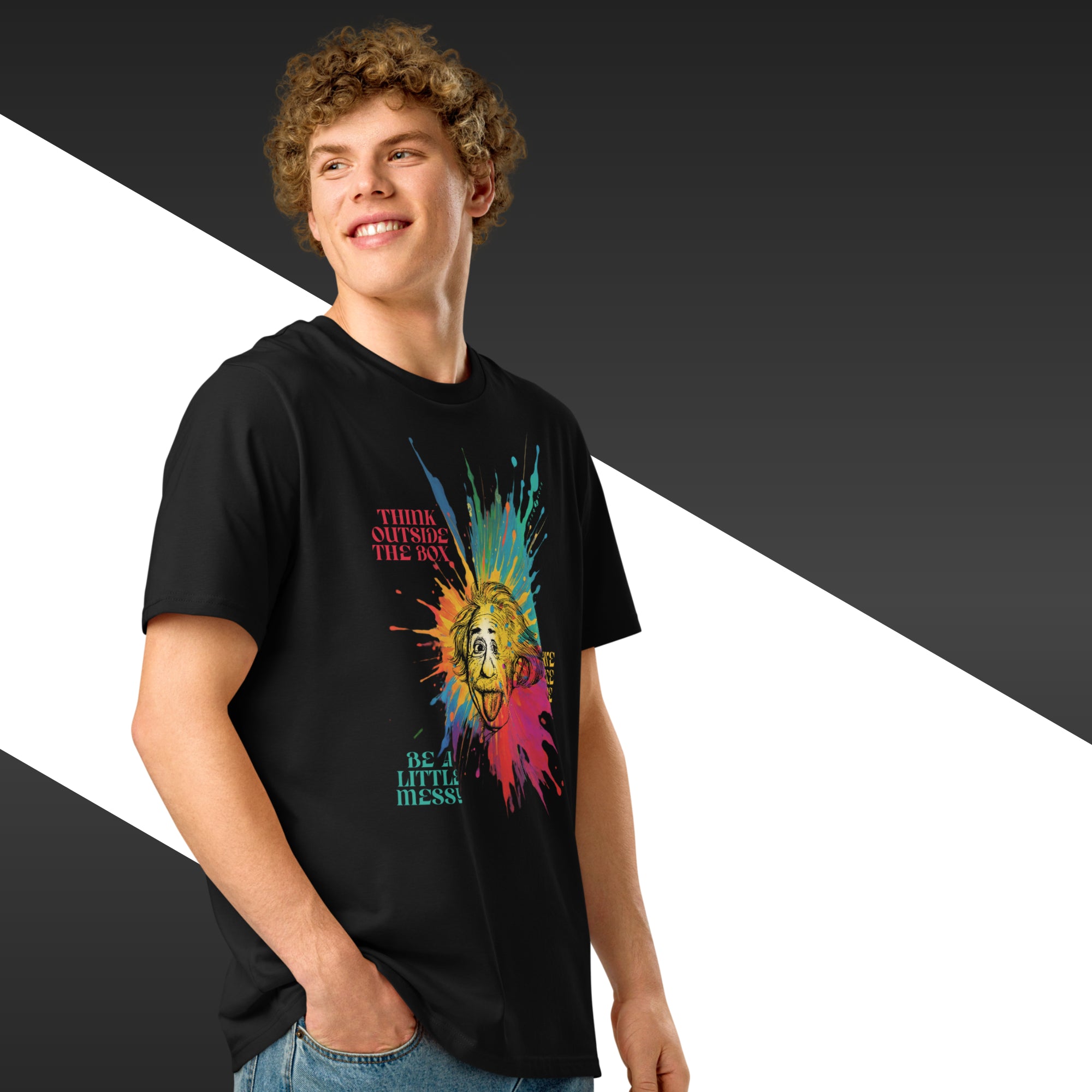 Man wearing a black t-shirt with colorful graphic design and text.