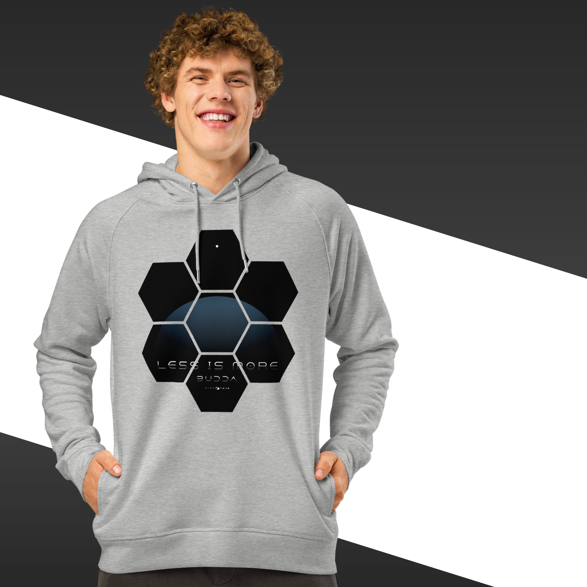 Person wearing a gray hoodie with a black geometric design on a black and white background
