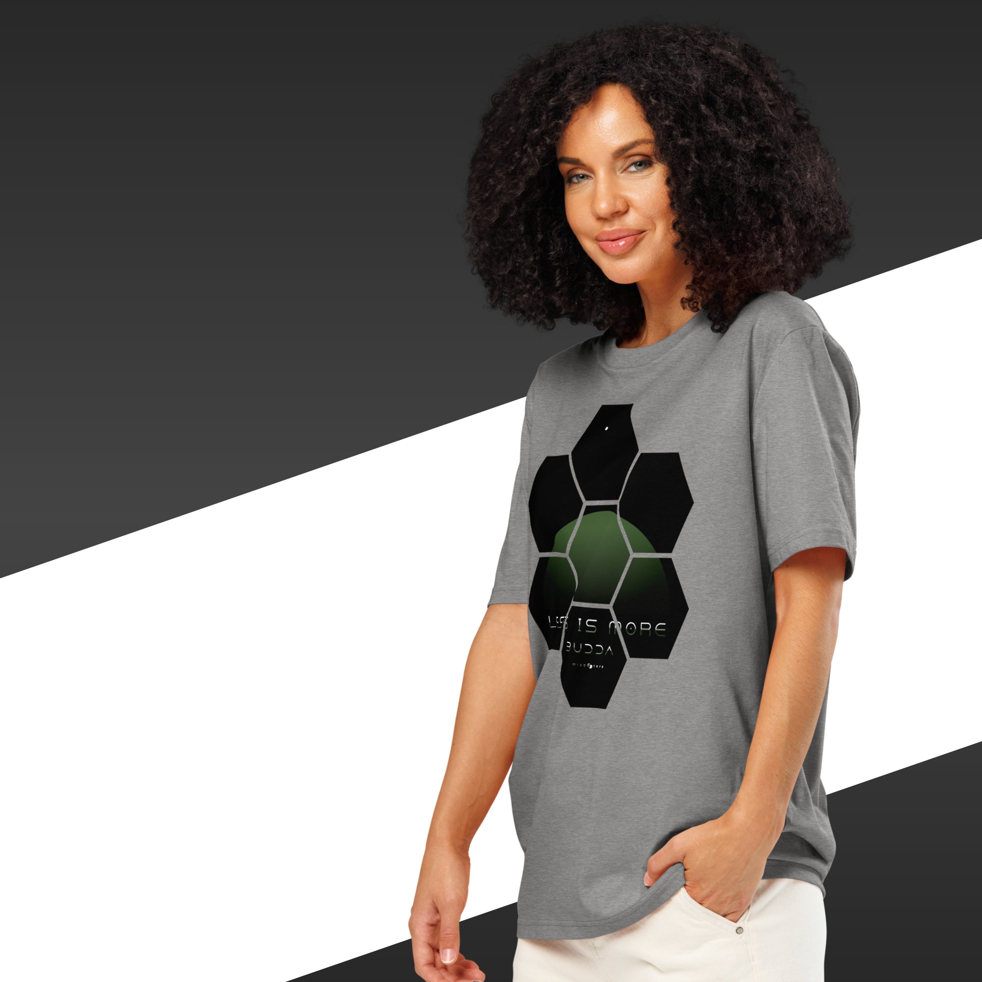 Woman wearing a gray t-shirt with a geometric design on a black and white background