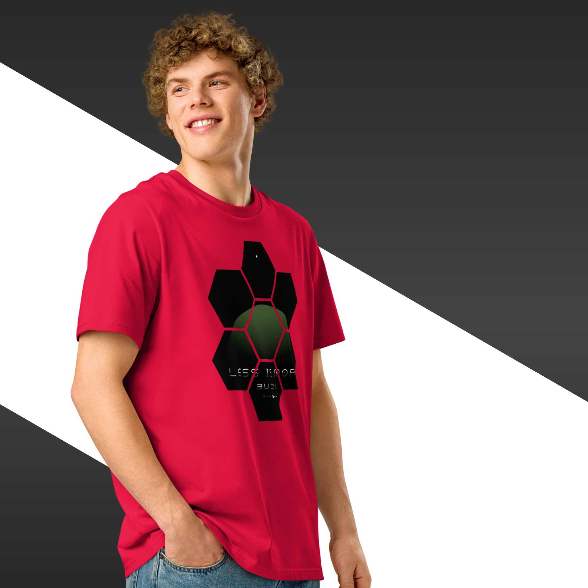 Person wearing a red t-shirt with a black and green graphic design on a black, white, and grey background