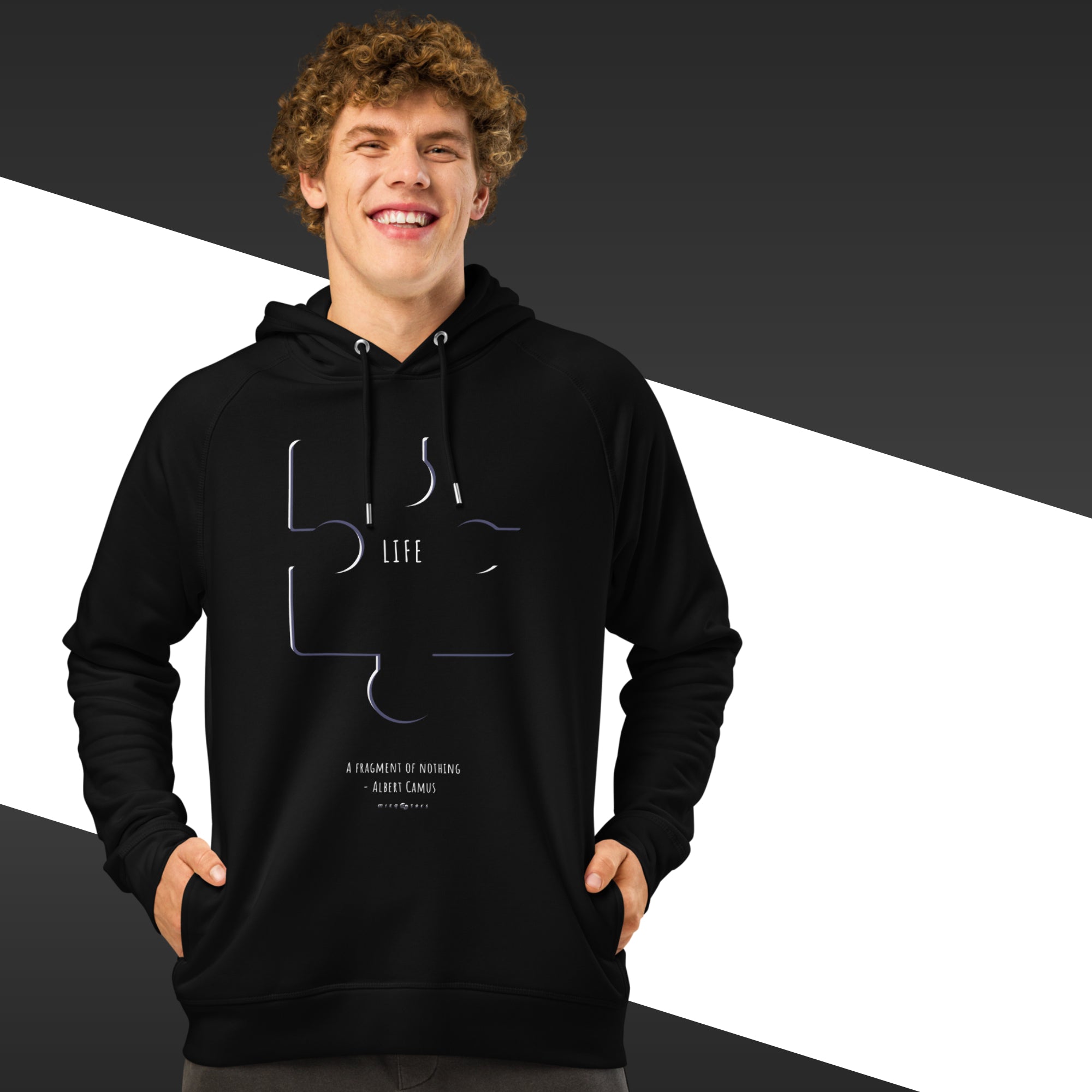 Person wearing a black hoodie with a design and text on a black and white background