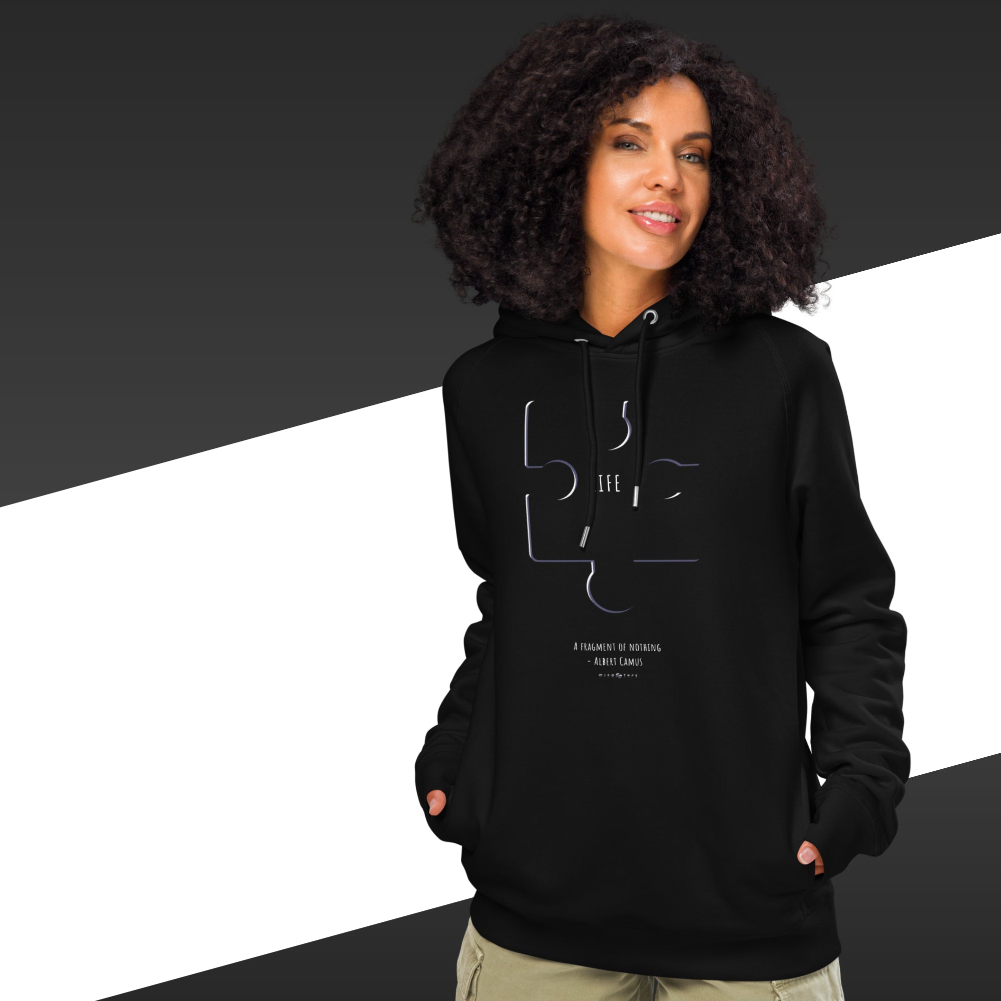 Person wearing a black hoodie with a design on a black and white background