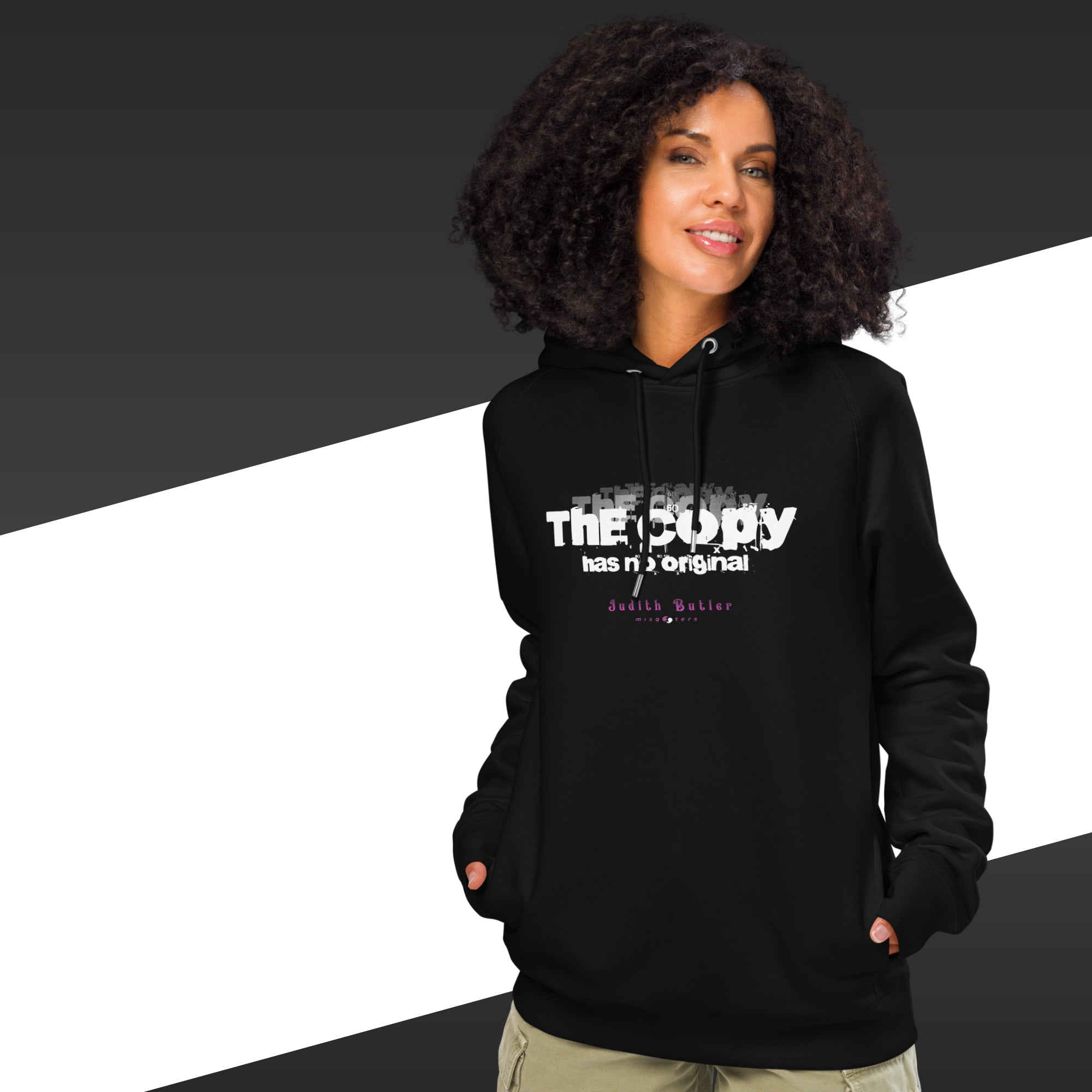 Person wearing a black hoodie with text on a black and white background