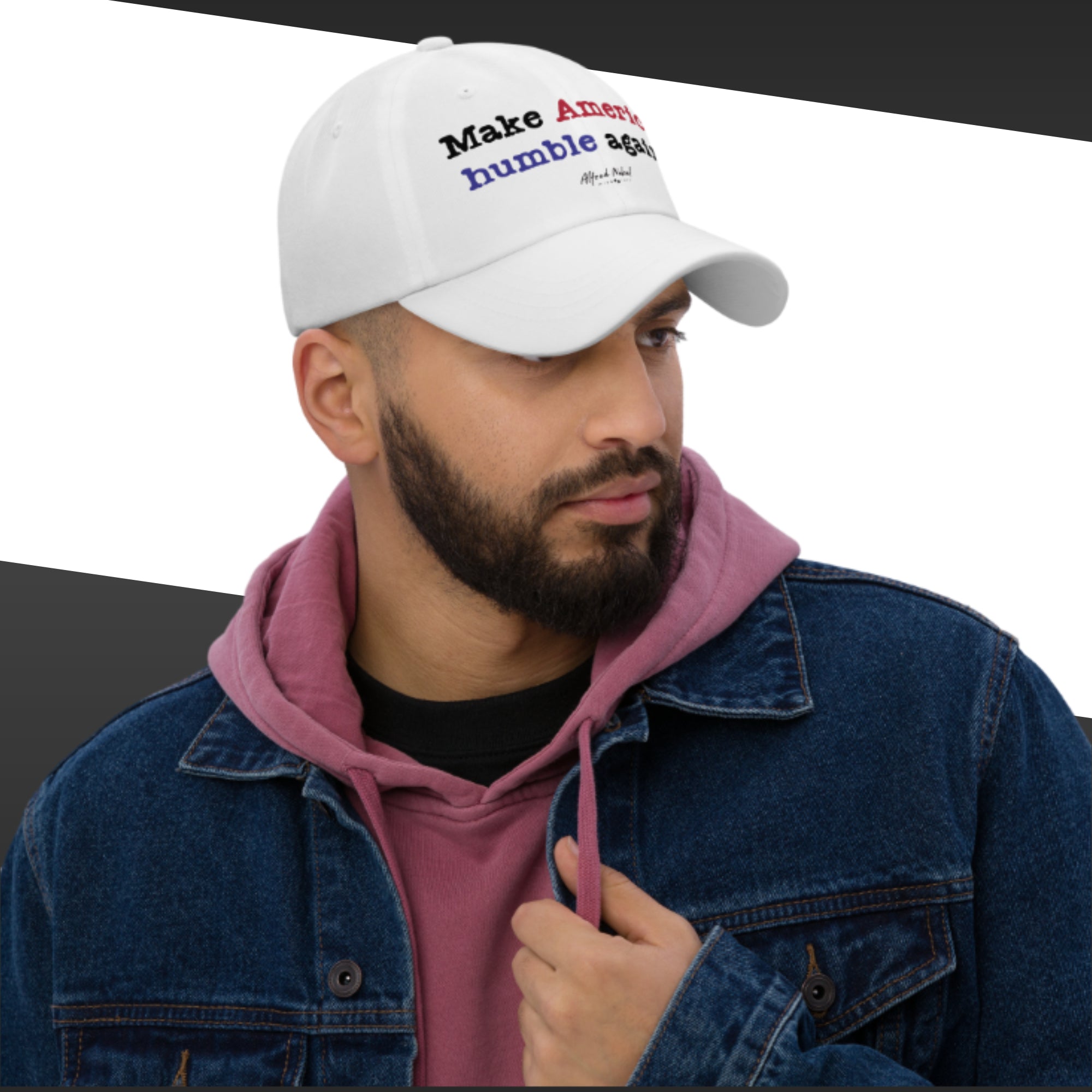 Man wearing a white cap with text, pink hoodie, and blue jacket on a white background