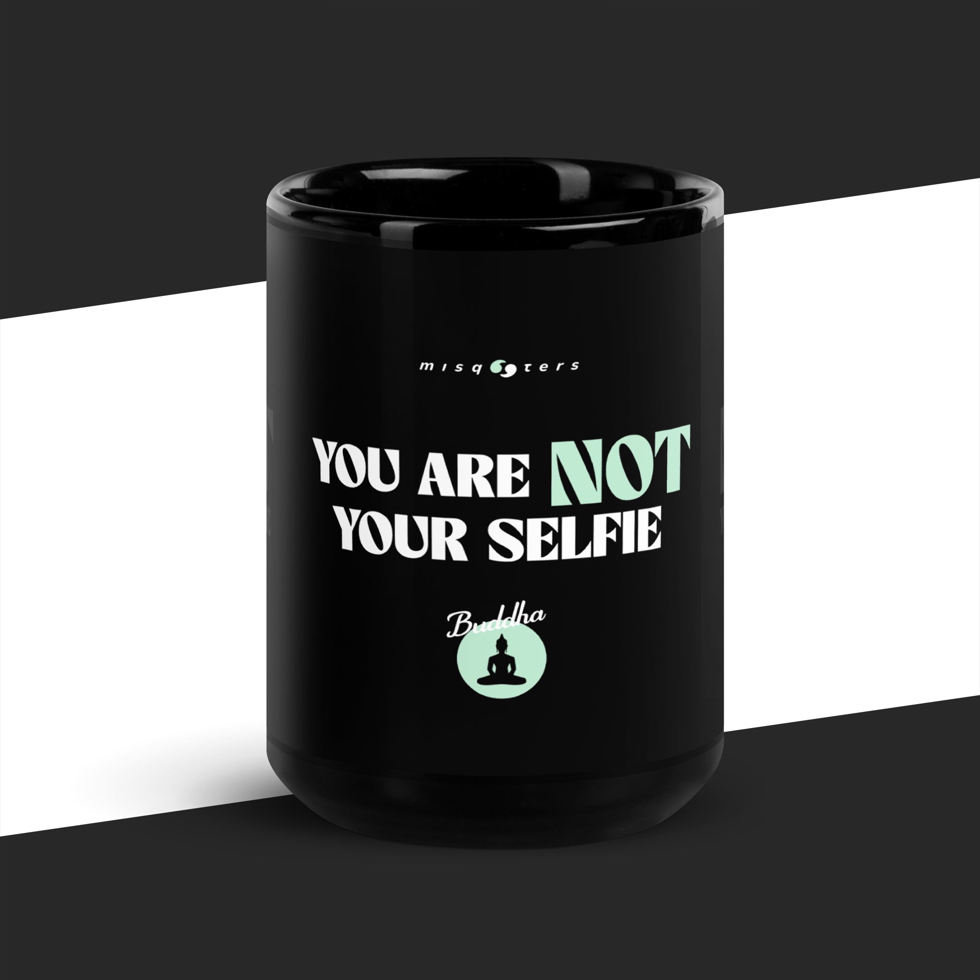 Black mug with motivational quote on a black and white background