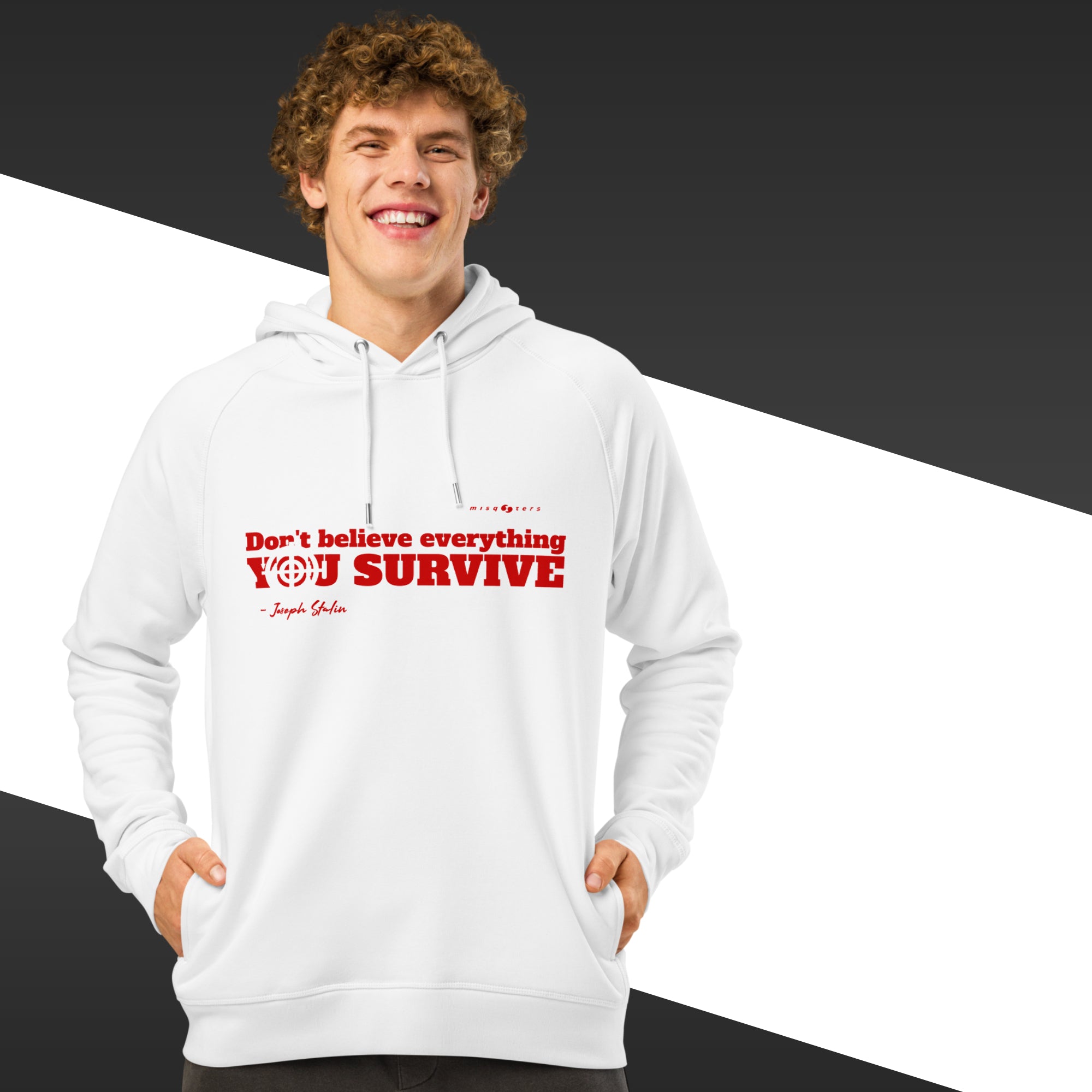 Man with white hoodie with a red text on and in the background there is black and white stripes