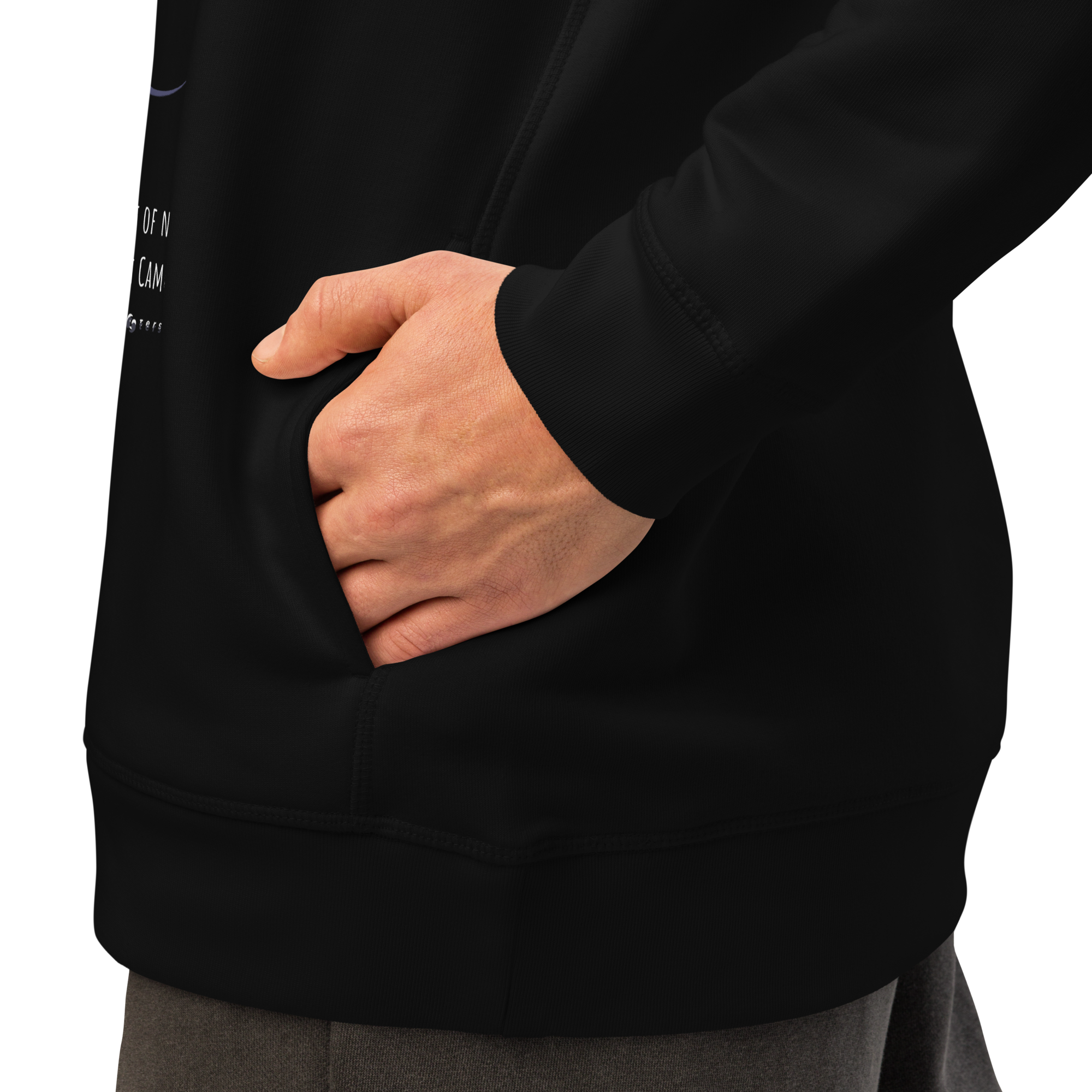 Person wearing a black hoodie with a hand in the pocket on a white background
