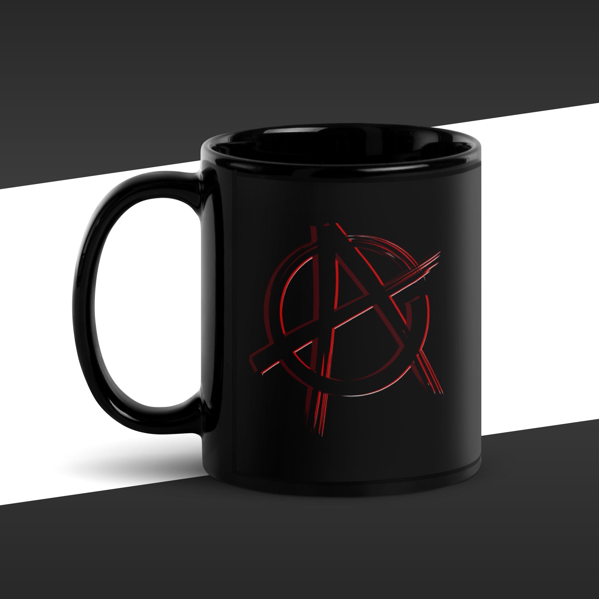 Black mug with a red anarchy symbol design on