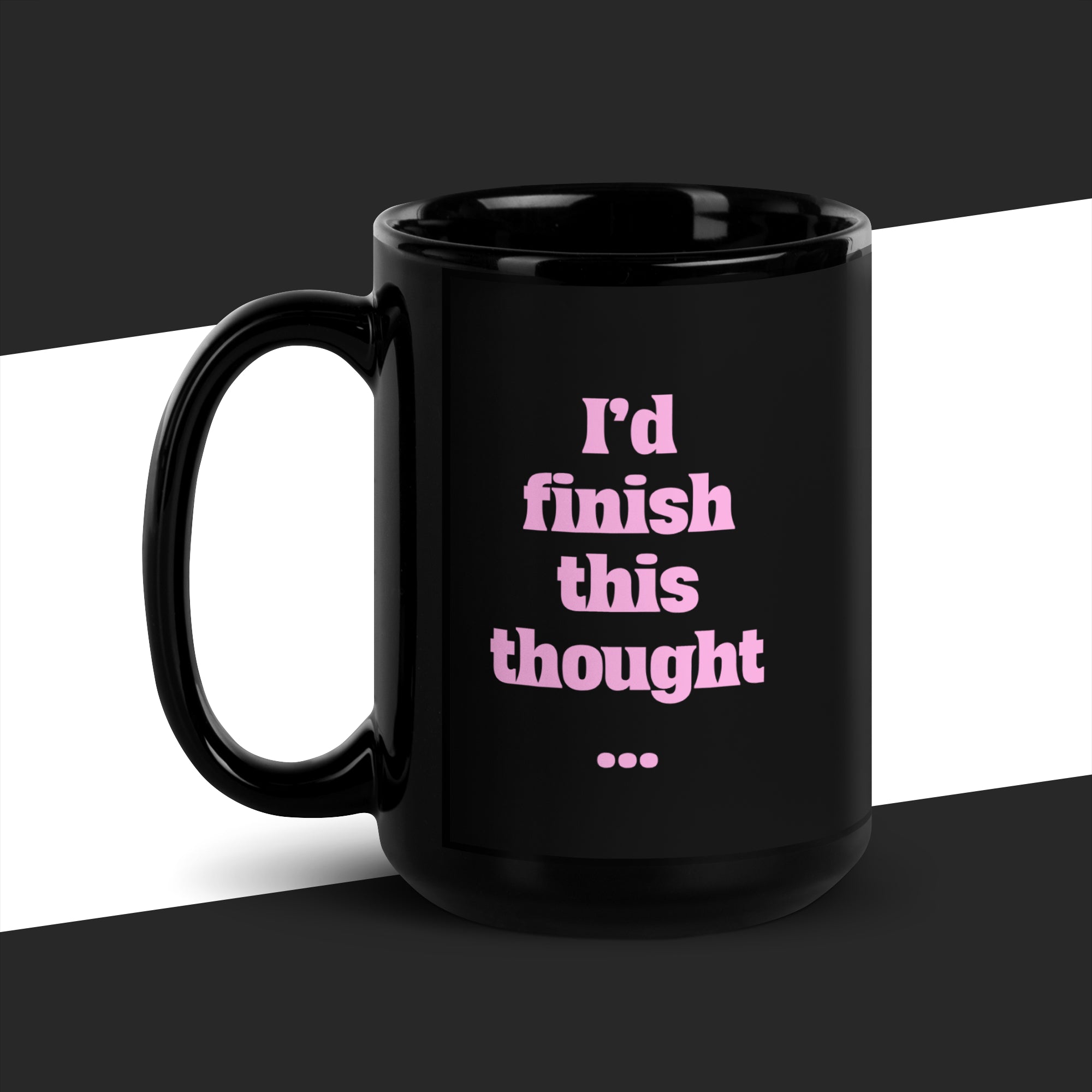 Big black mug with pink text 'I'd finish this thought...' on a black and white background