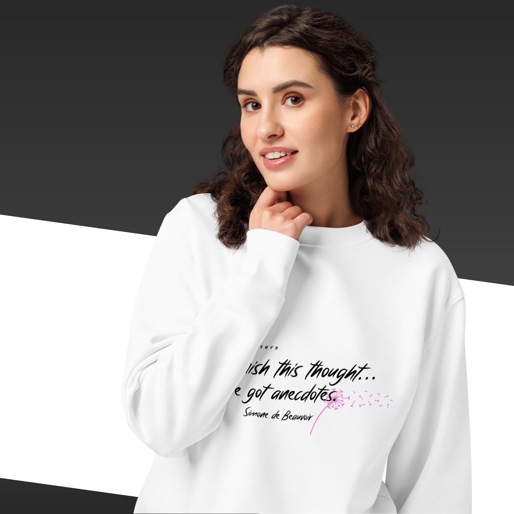 Woman with a white sweatshirt and a white and pink Simone de Beauvoir quote on it