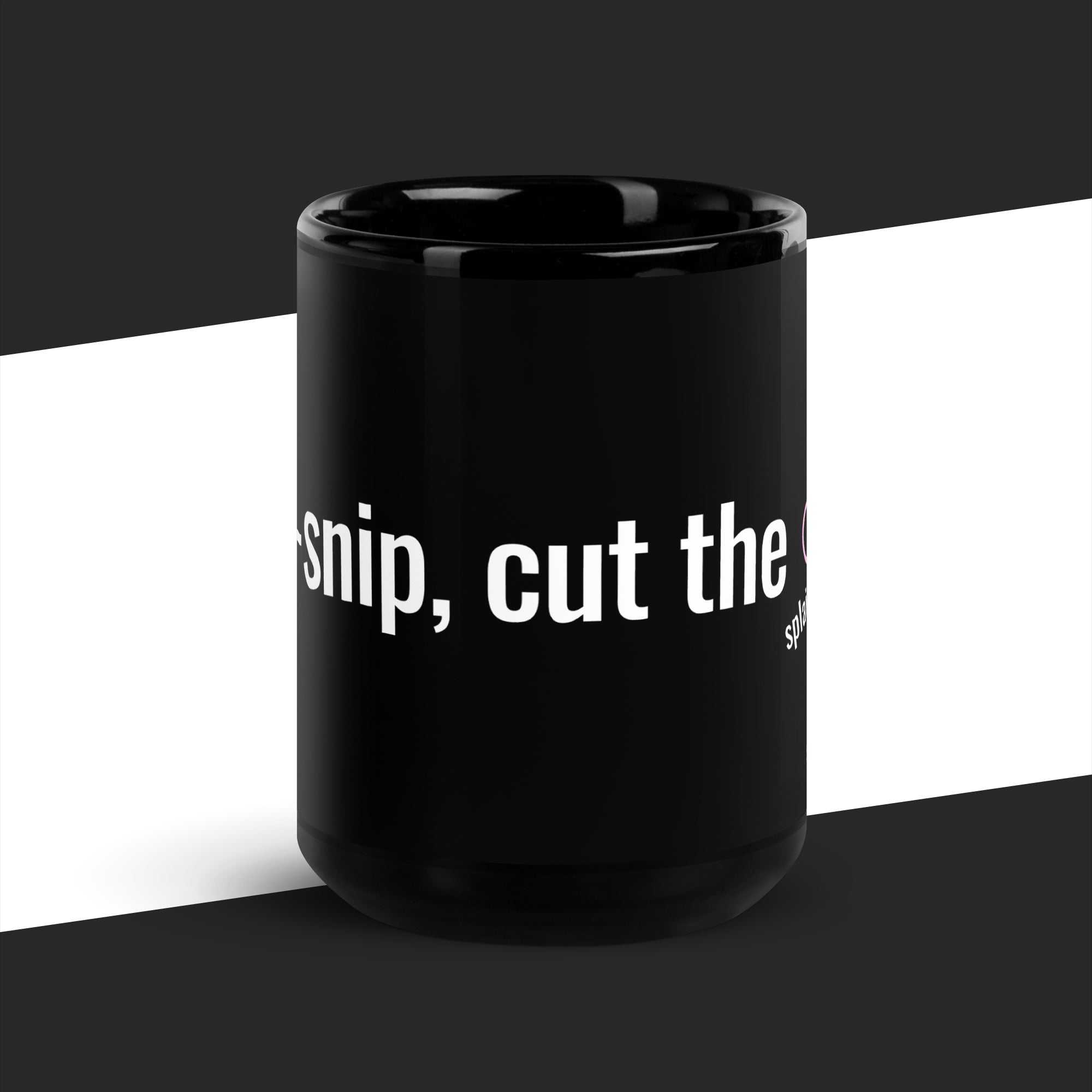 Black mug with white text on a black and white striped background