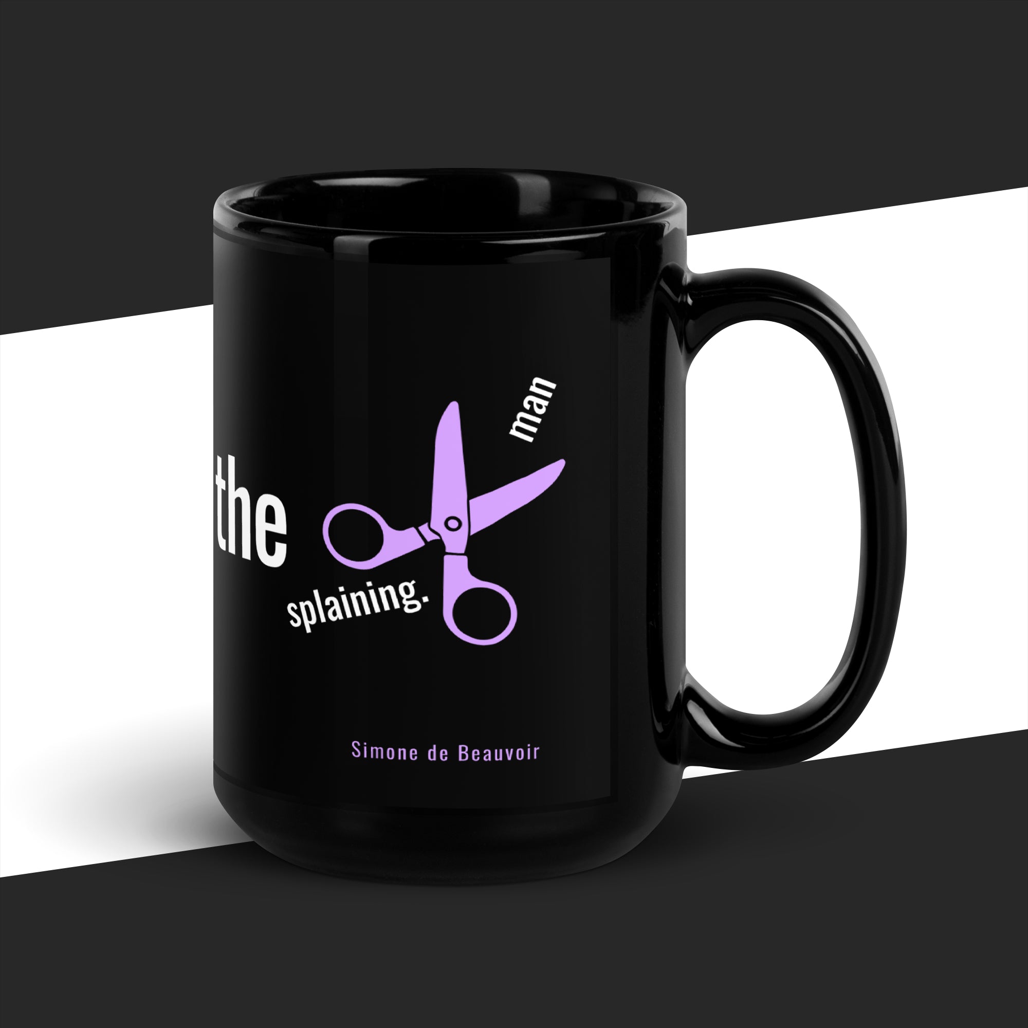 Black mug with purple scissors graphic and text on a black and white background