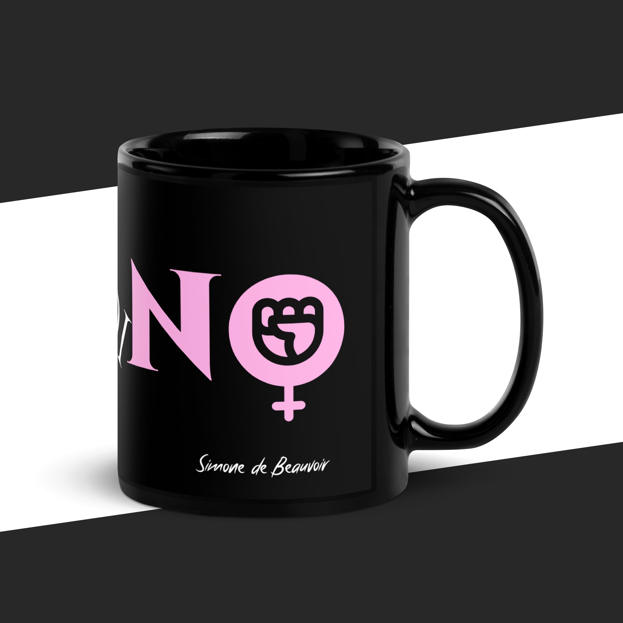 Black mug with pink graphic and text on a black and white background