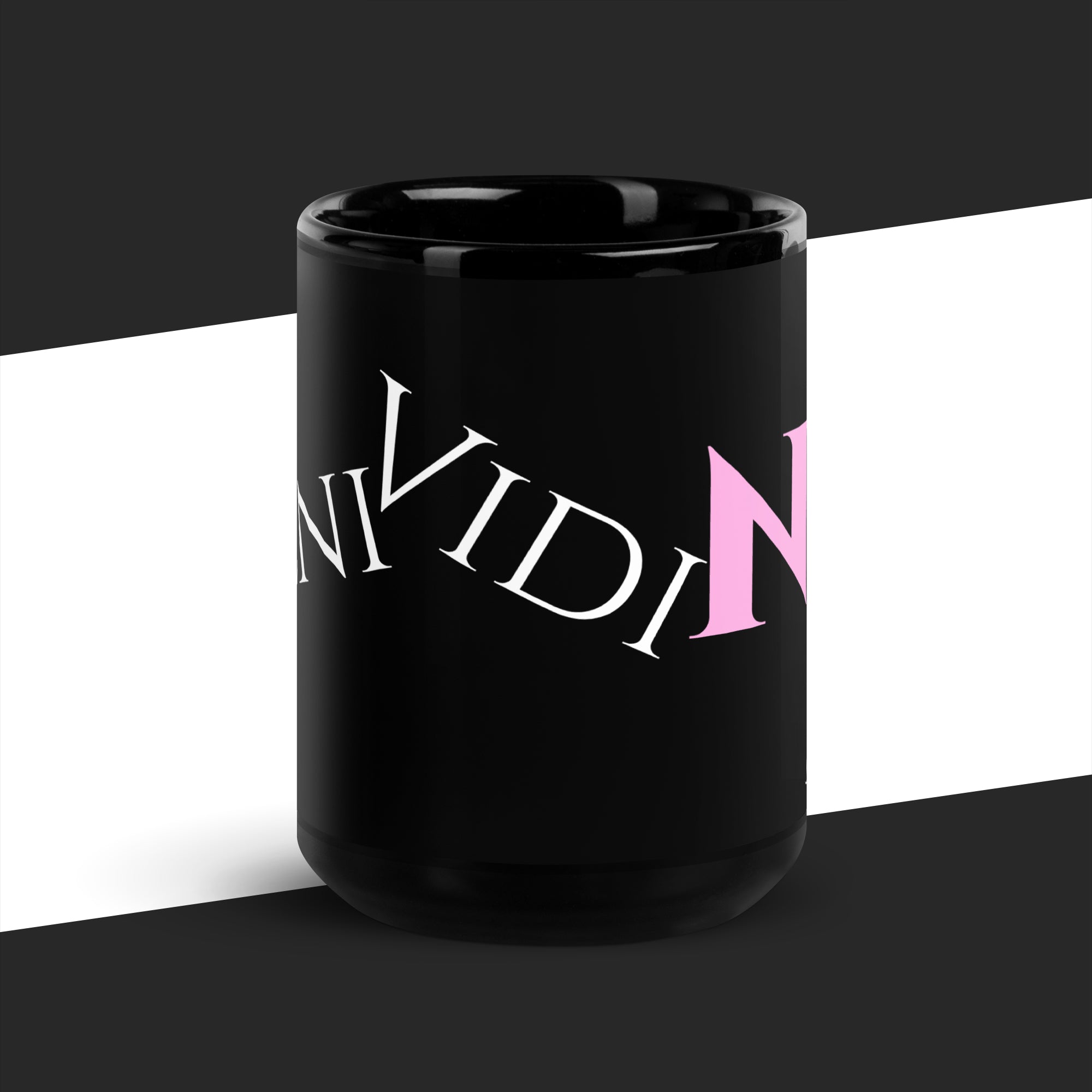 Big black mug with pink and white text on a black and white background