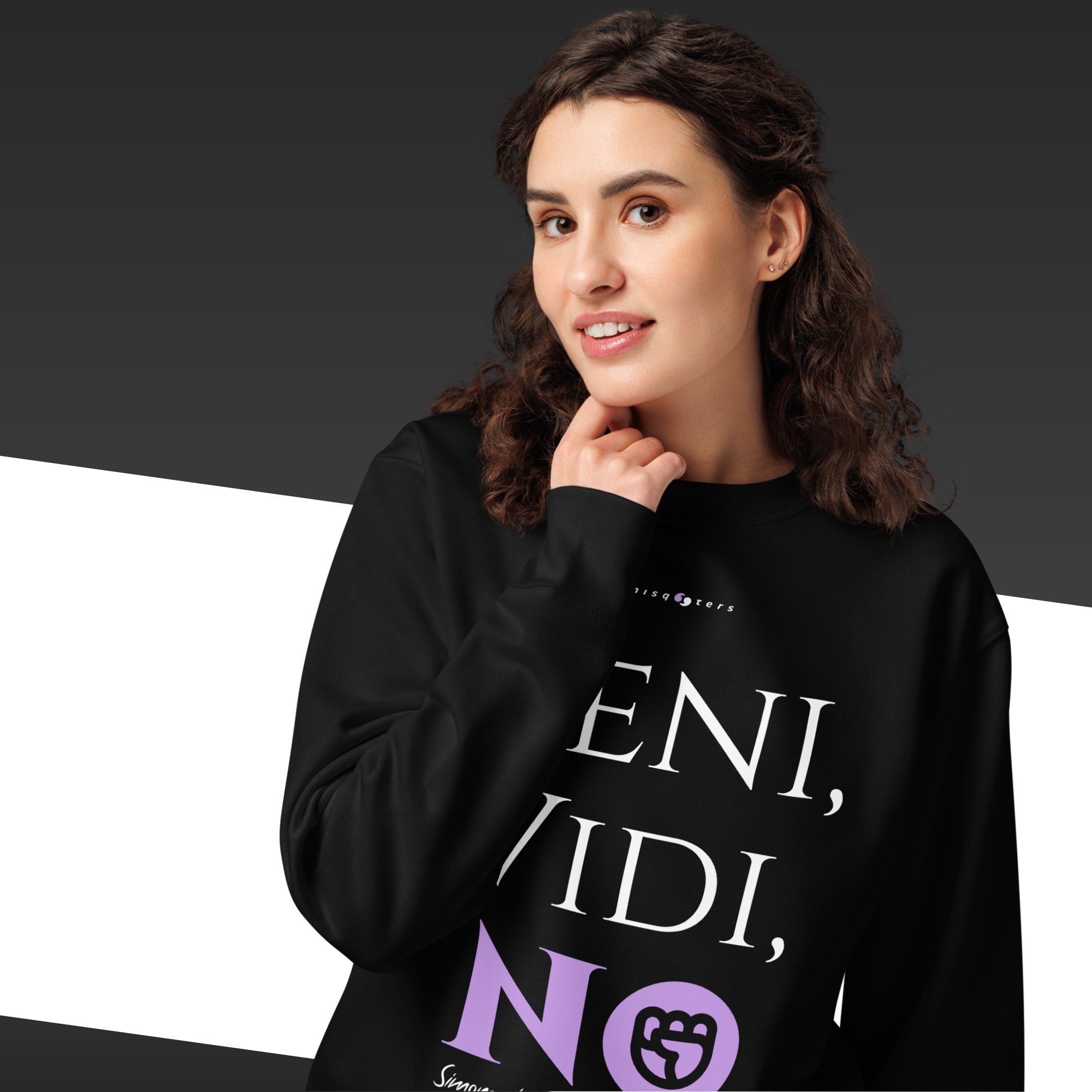 Person wearing a black hoodie with text and a logo on a dark background