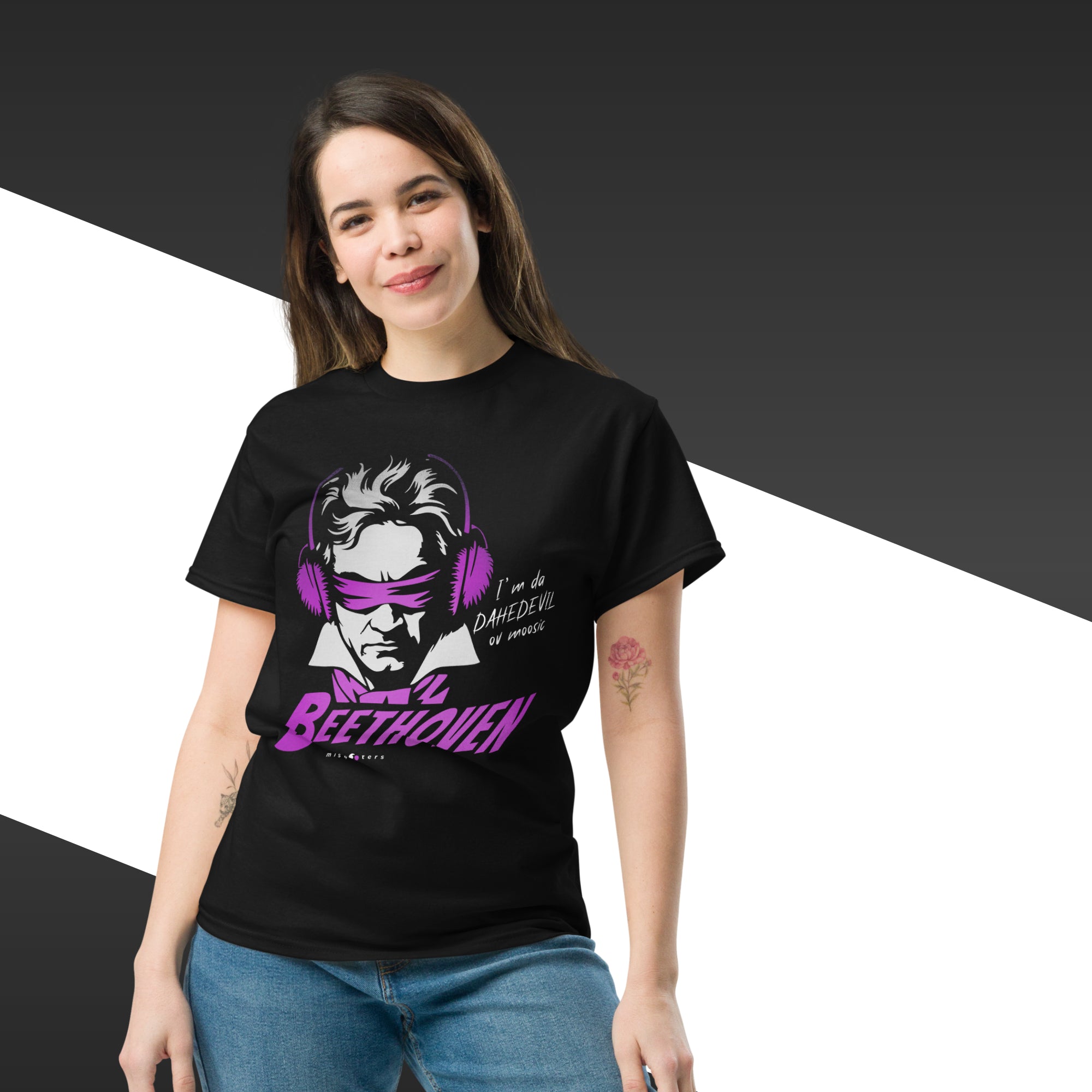 Person wearing a black t-shirt with a graphic design of Beethoven wearing headphones and text.