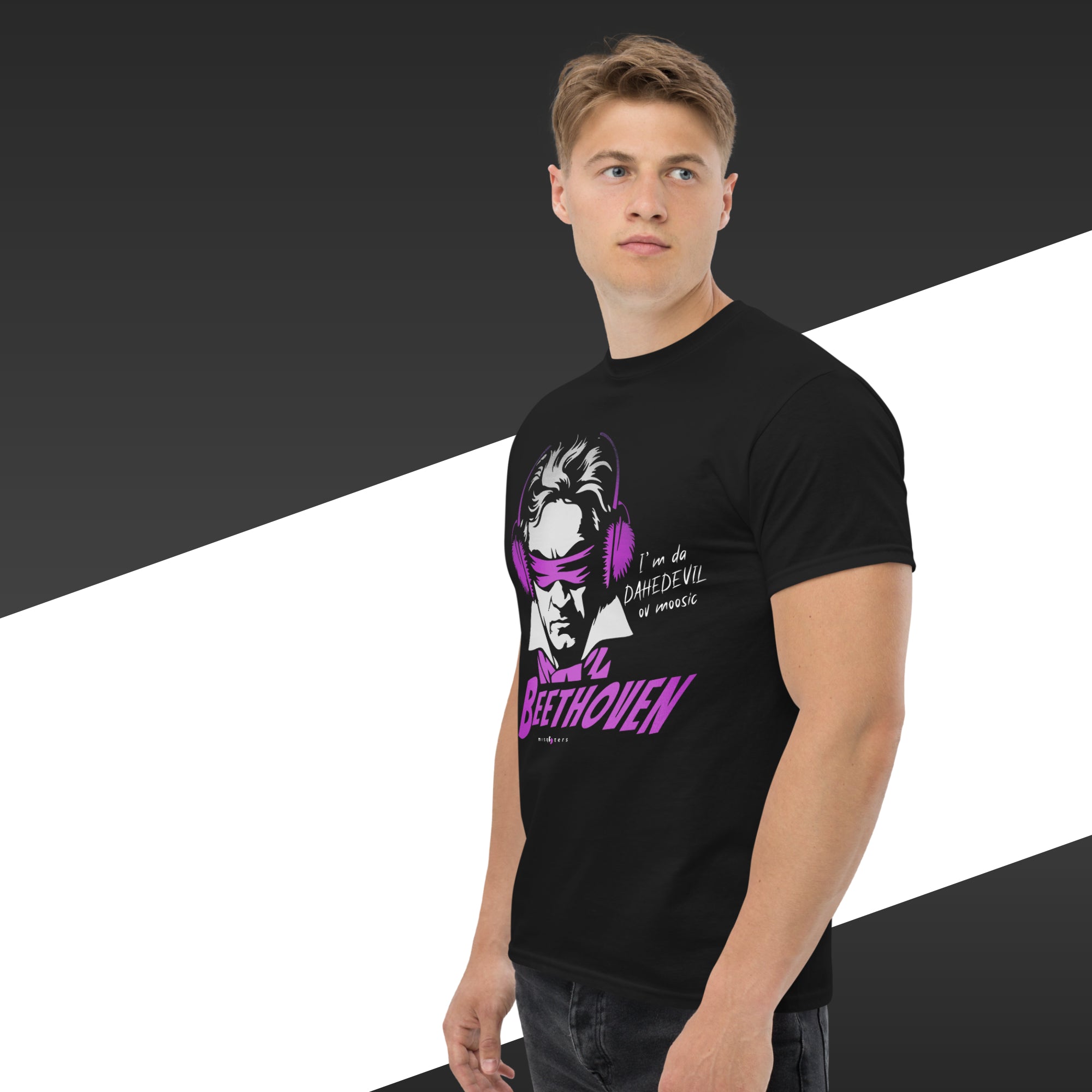 Person wearing a black t-shirt with a graphic design and text on a black and white background