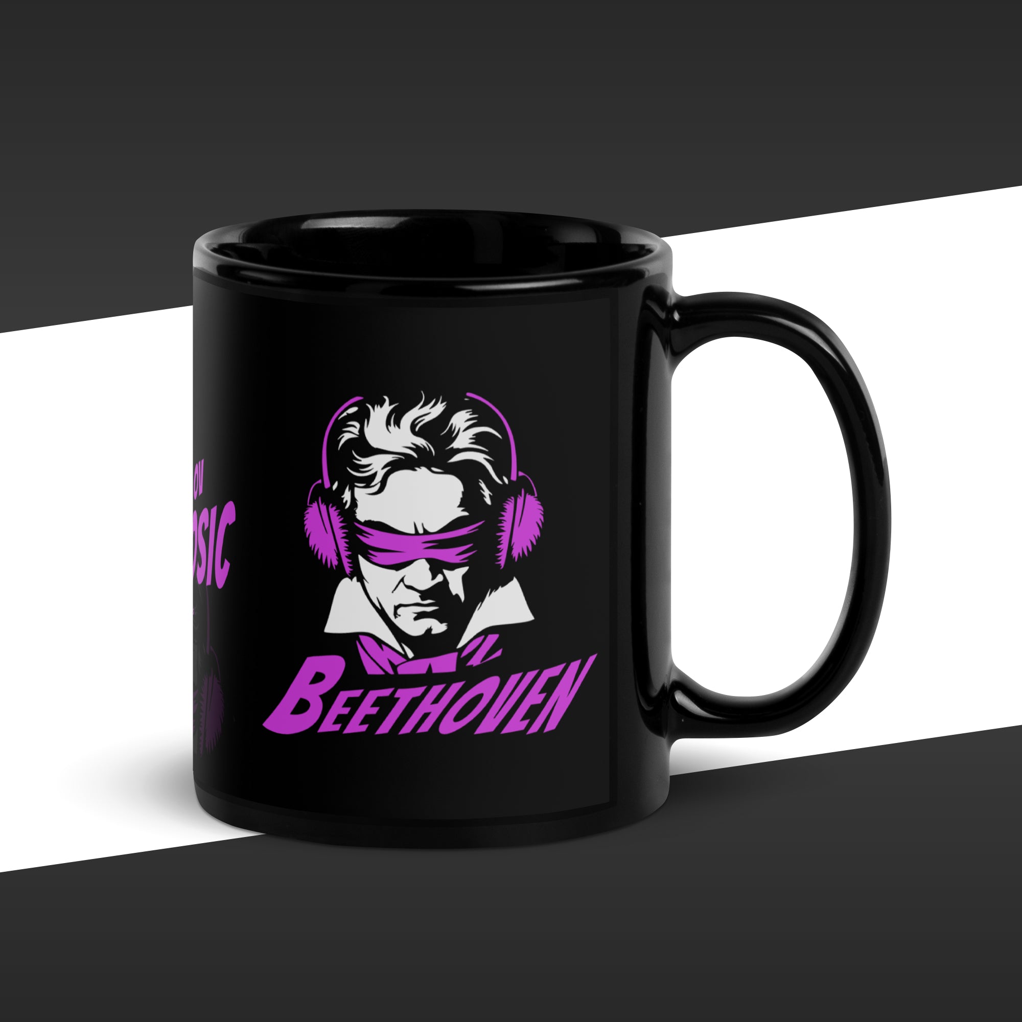 Black mug with a graphic of Beethoven wearing headphones and text on a white background