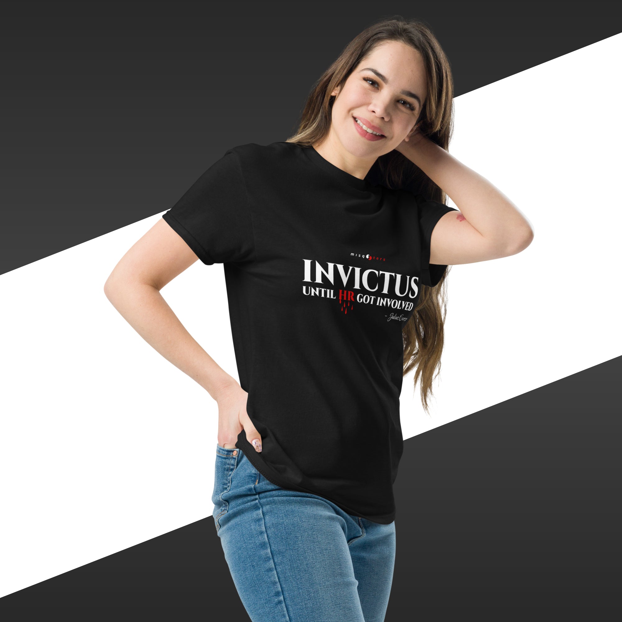 Woman wearing a black t-shirt with 'Invictus' text on a white and black striped background