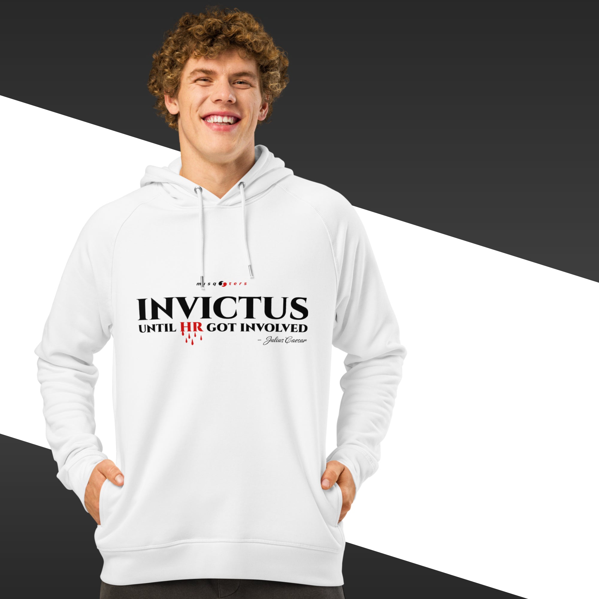 Person wearing a white hoodie with text design on a black and white background