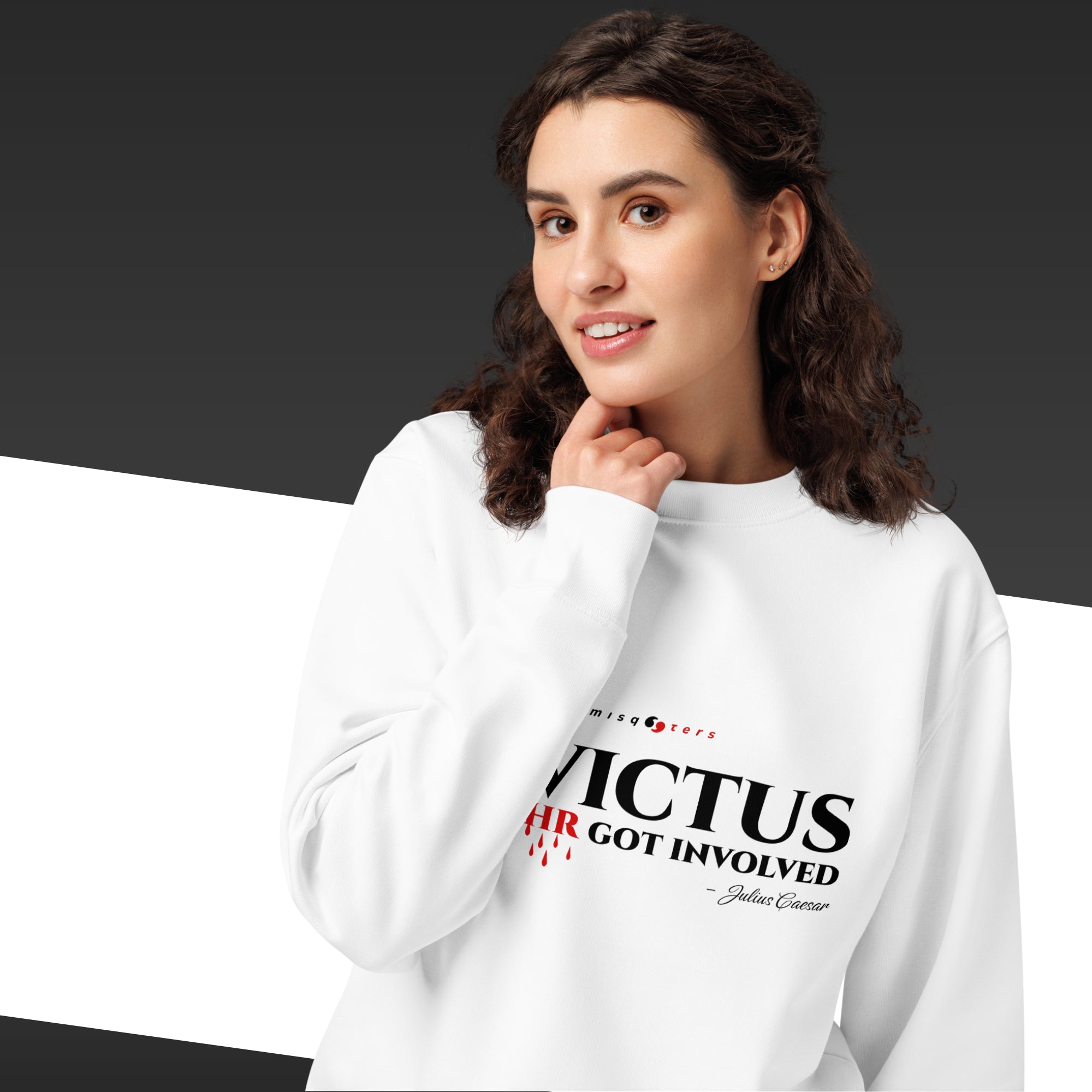 Woman wearing a white sweatshirt with text on a dark background