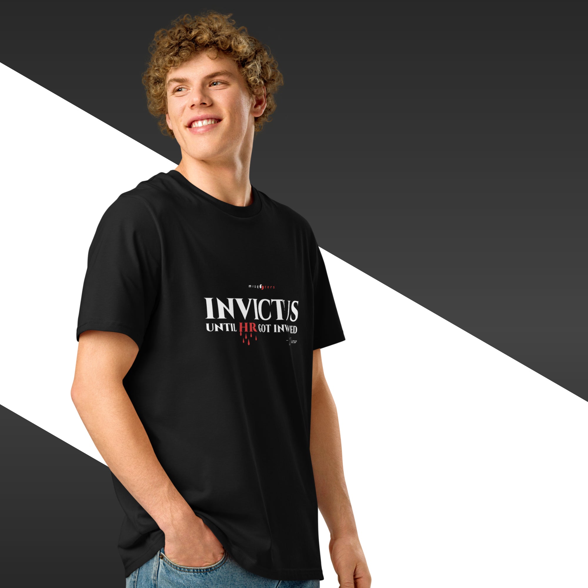 Person wearing a black t-shirt with 'INVICTUS' text on a black and white background