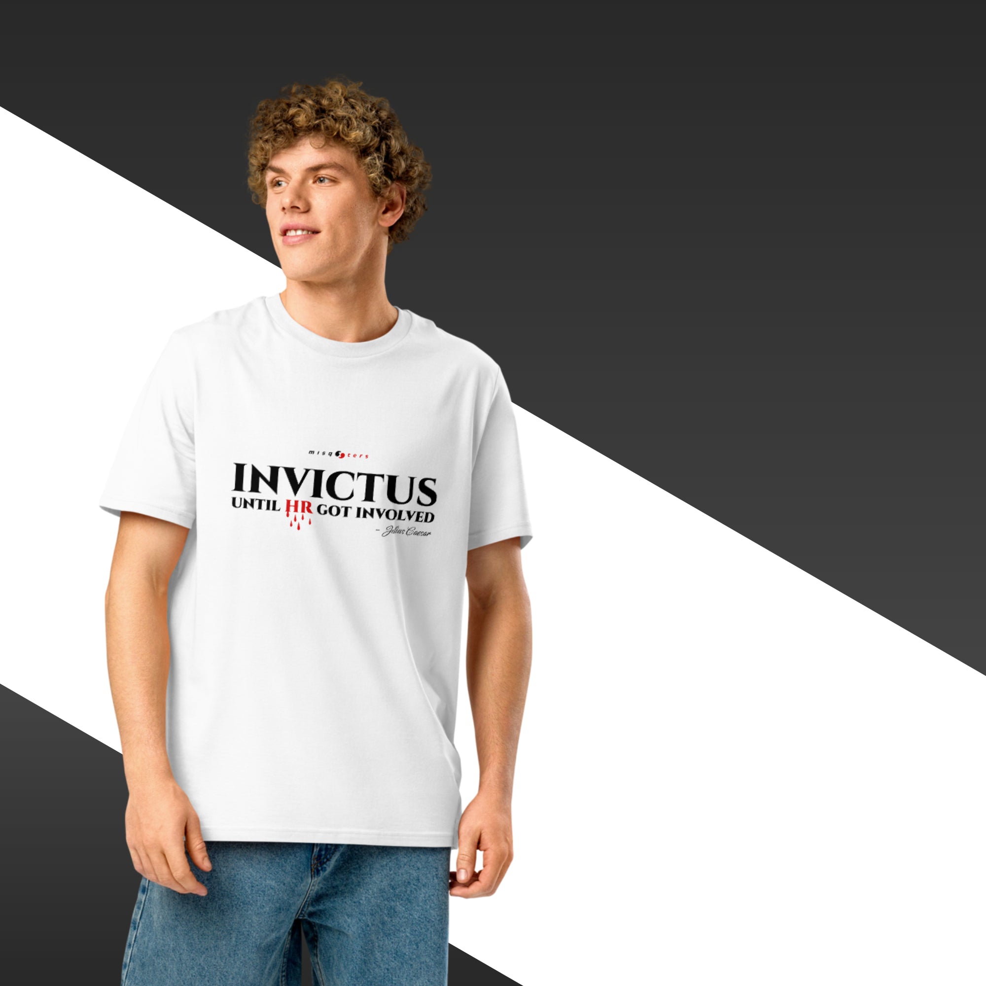 Person wearing a white t-shirt with 'Invictus' text on a black and white background