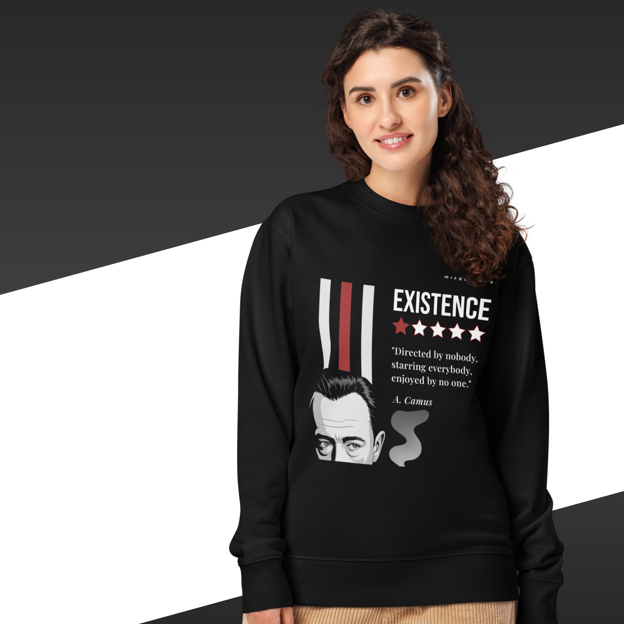 Person wearing a black sweatshirt with a graphic design and text on a dark background