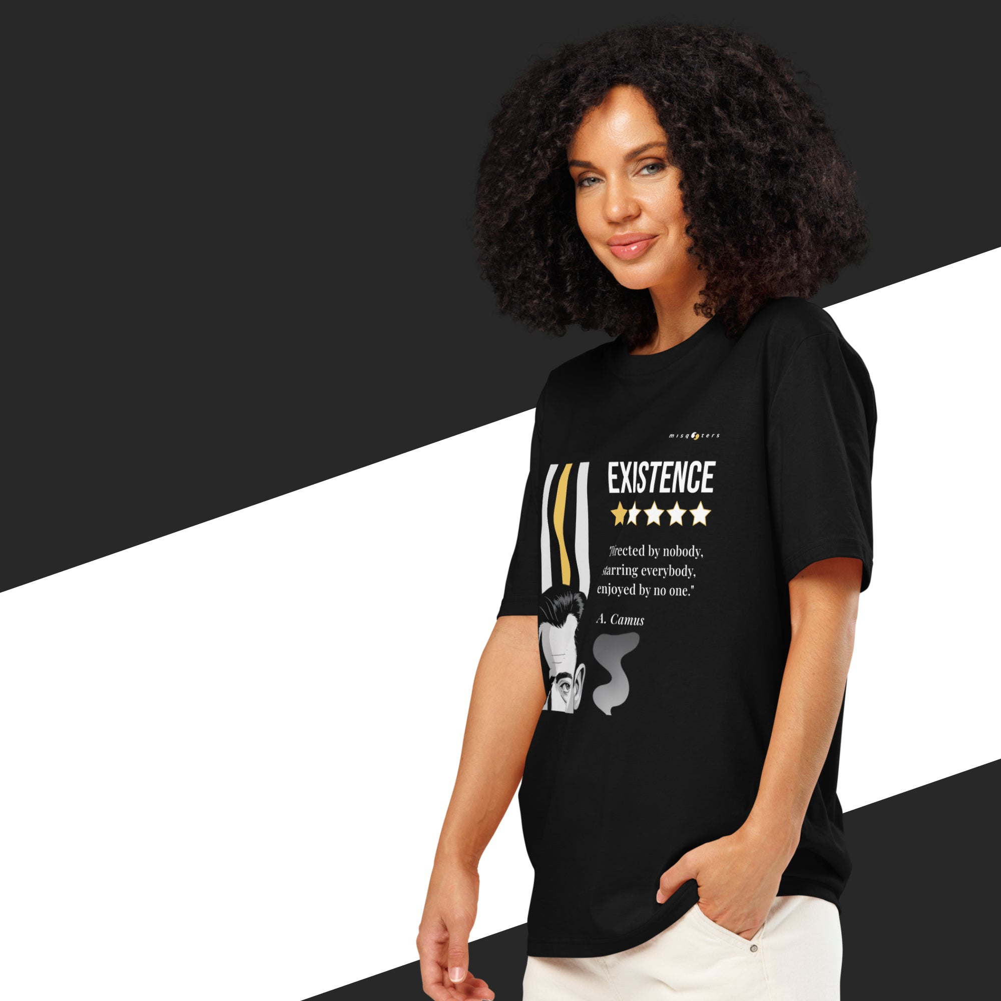 Woman wearing a black t-shirt with a white and yellow graphic of Albert Camus and a quote