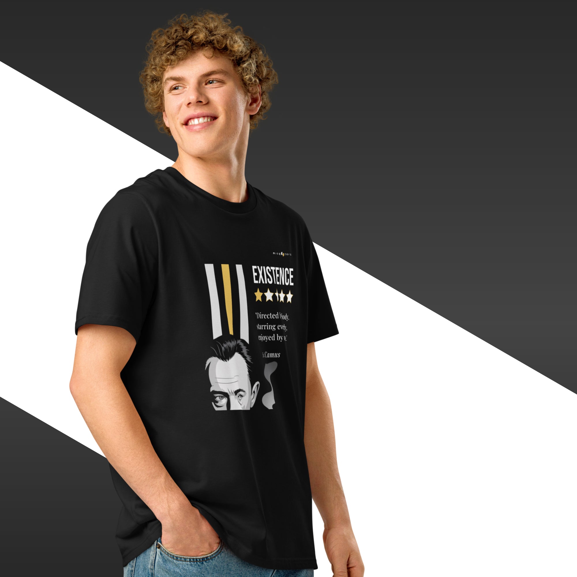 Man wearing a black t-shirt with a white and yellow graphic of Albert Camus and a quote