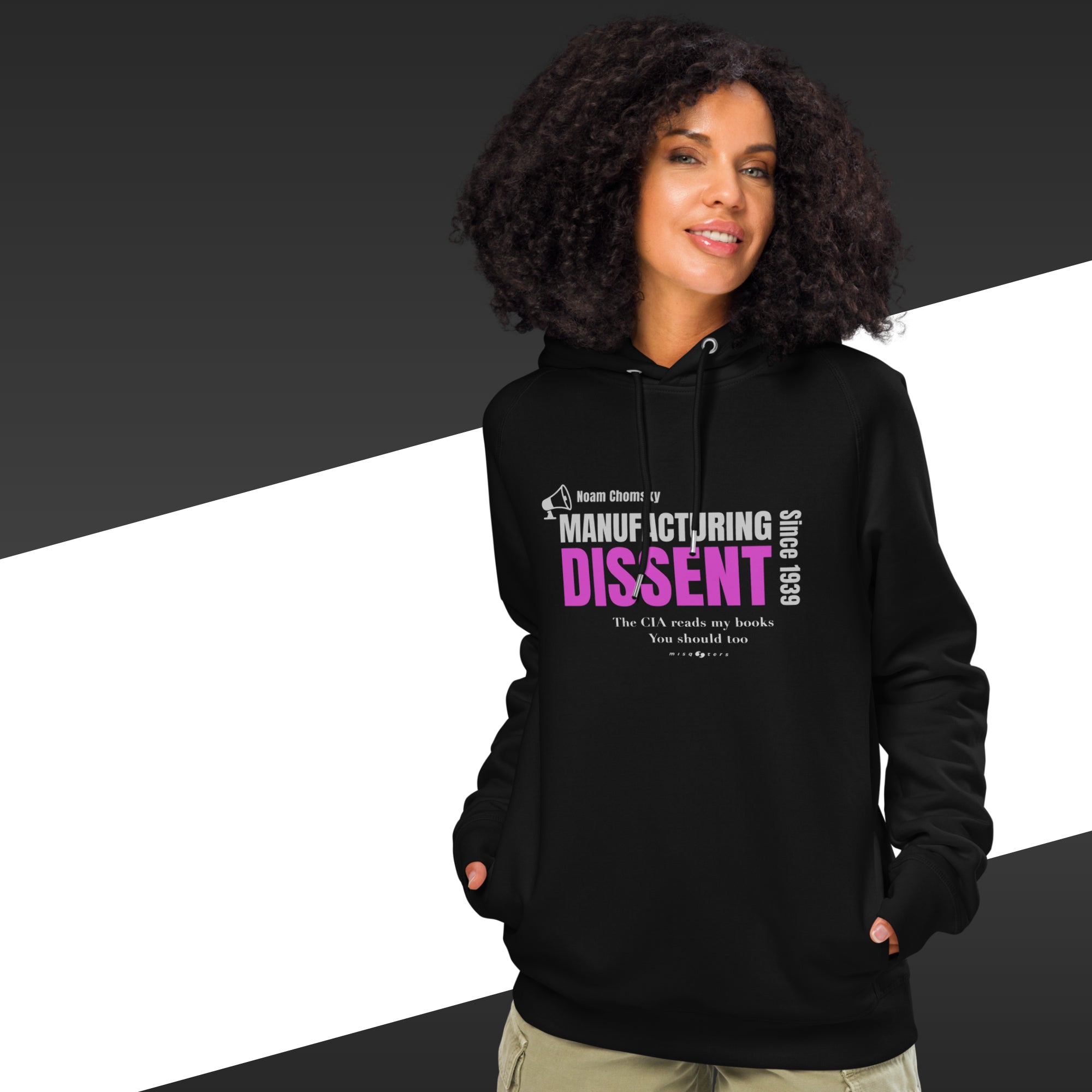 Man with black hoodie featuring the fake quote "manufacturing dissent" by Noam Chomsky in white and purple.