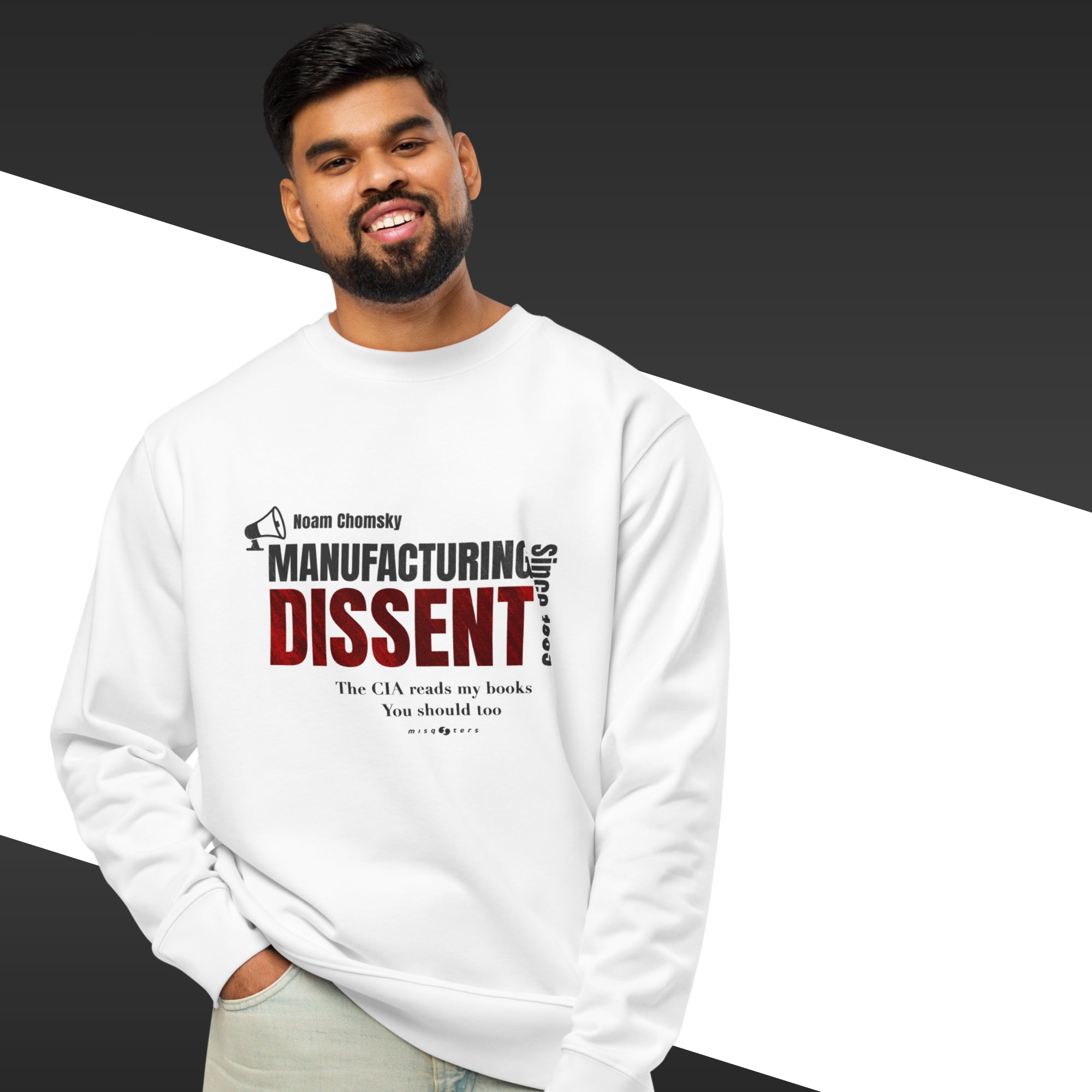 Man wearing a white sweatshirt with the quote "manufacturing dissent" from Noam Chomsky in purple