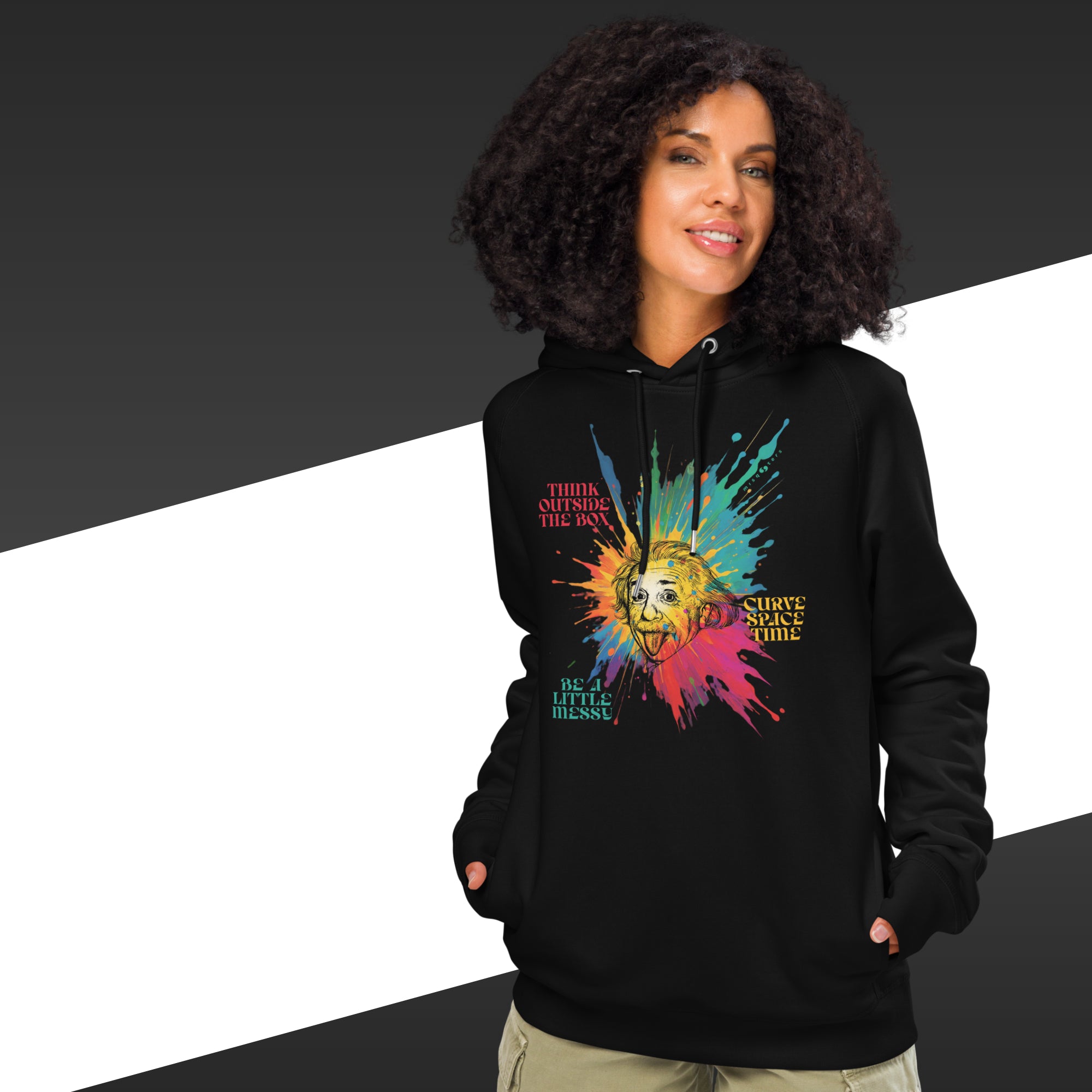 Person wearing a black hoodie with colorful graphic design on a black and white background