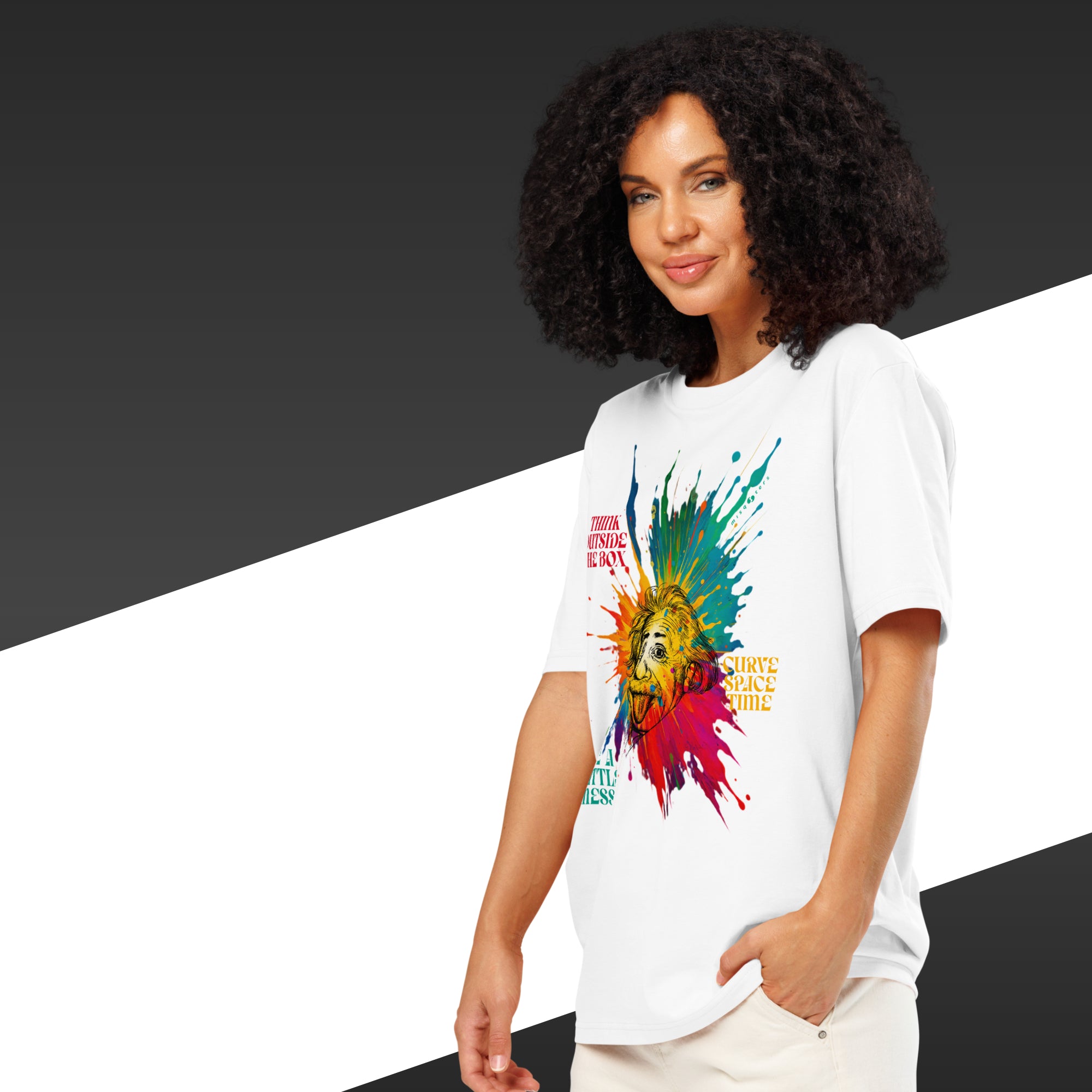 Woman wearing a white t-shirt with a colorful graphic design on a black and white background