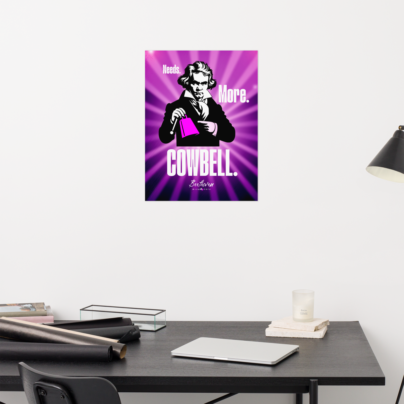 Poster of a character holding a cowbell on a purple background above a desk.