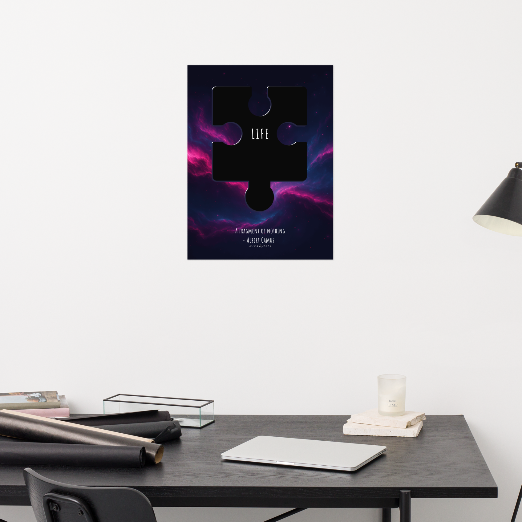 Poster with a puzzle piece design and 'Life' text on a wall above a desk.