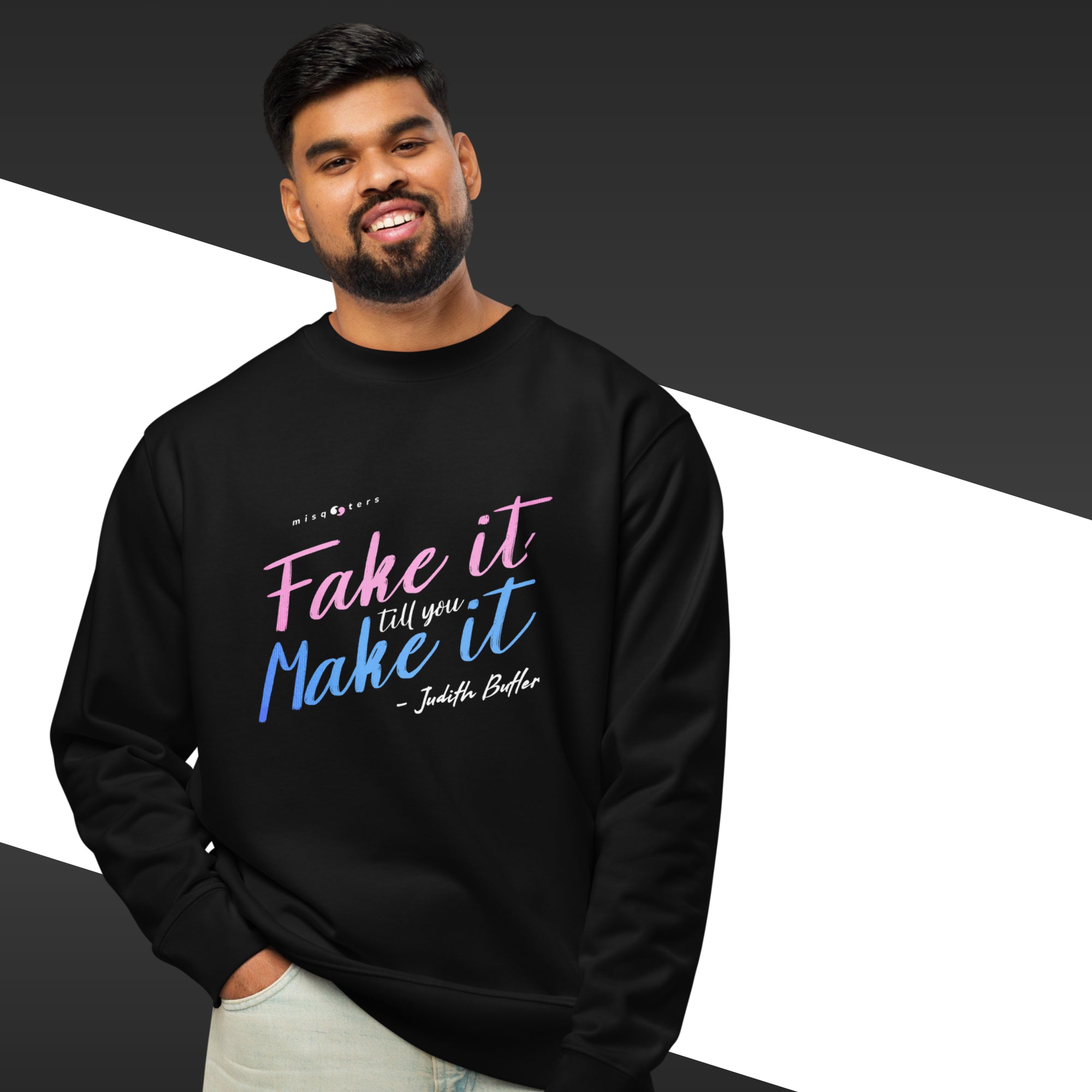 Man wearing a black sweatshirt with colorful text on a black and white background
