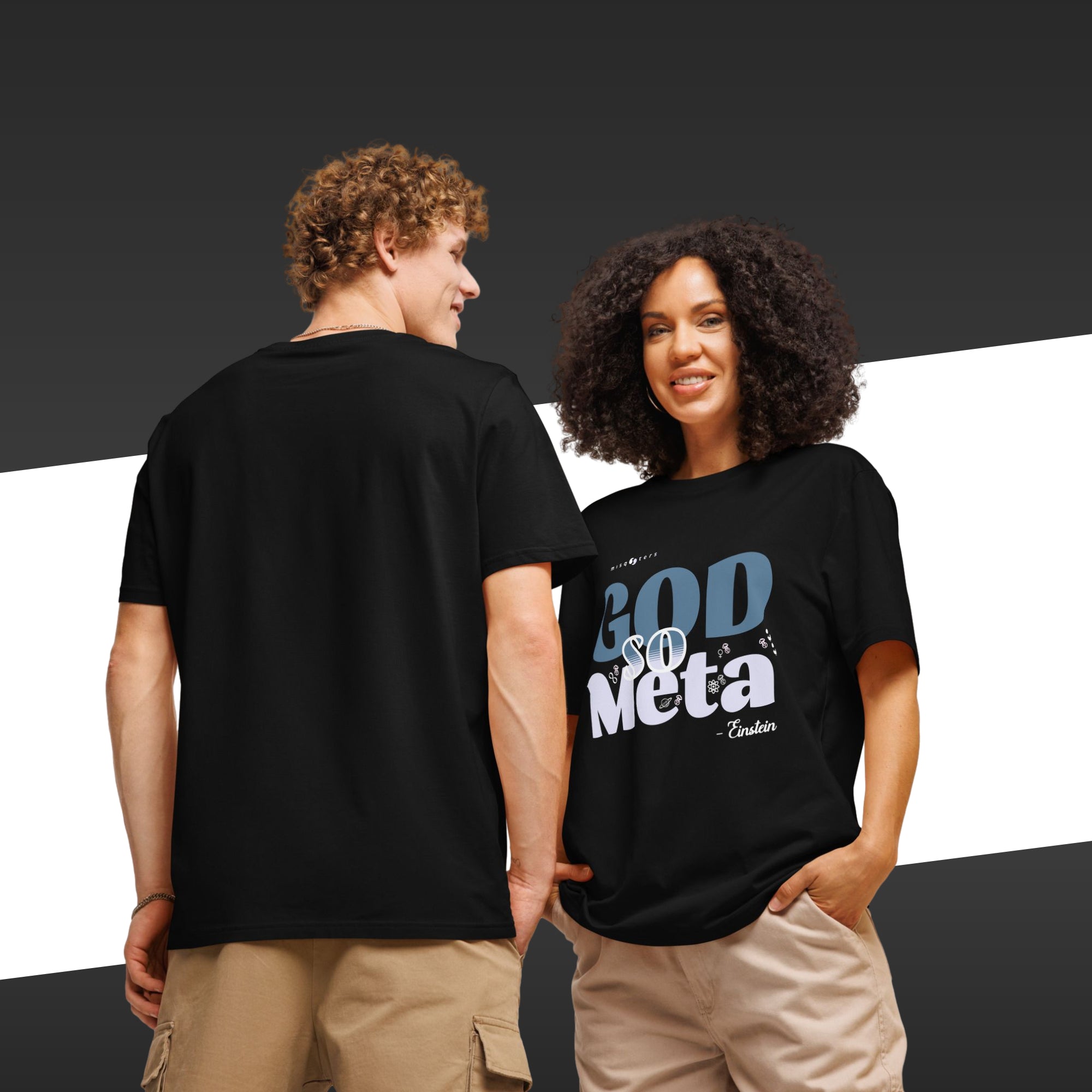 Two people wearing black t-shirts with text, one facing the camera and the other back to the camera.