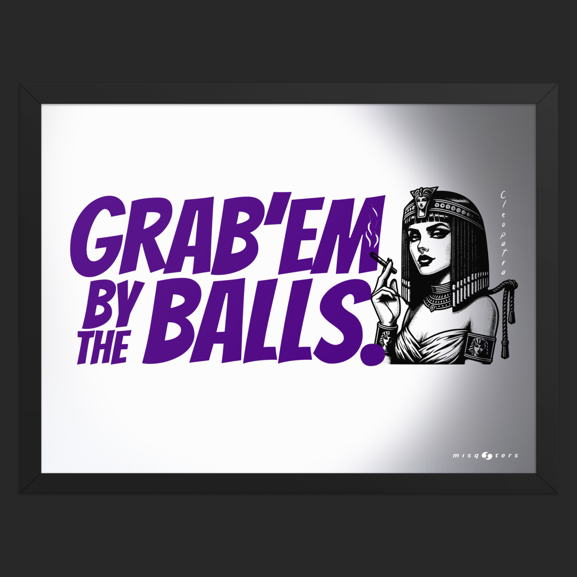Framed artwork with a graphic of a woman and text 'GRAB'EM BY THE BALLS.' in purple on a gray background.