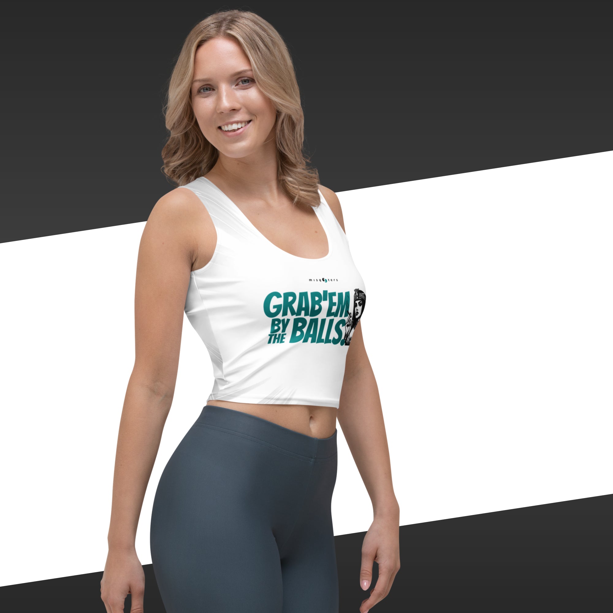 Woman wearing a white tank top with text and dark leggings on a black and white background