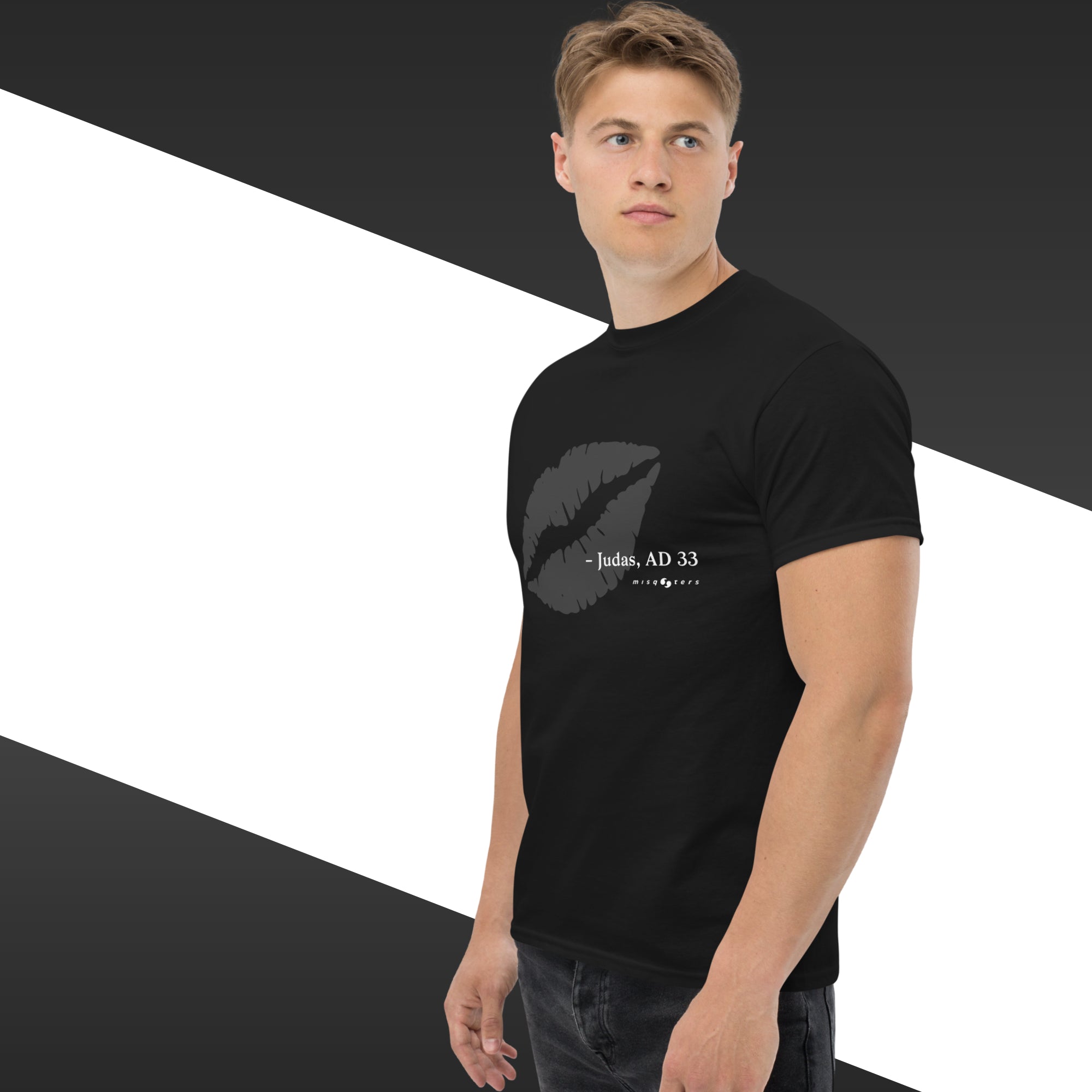 Man wearing a black t-shirt with a graphic design and text on a geometric background